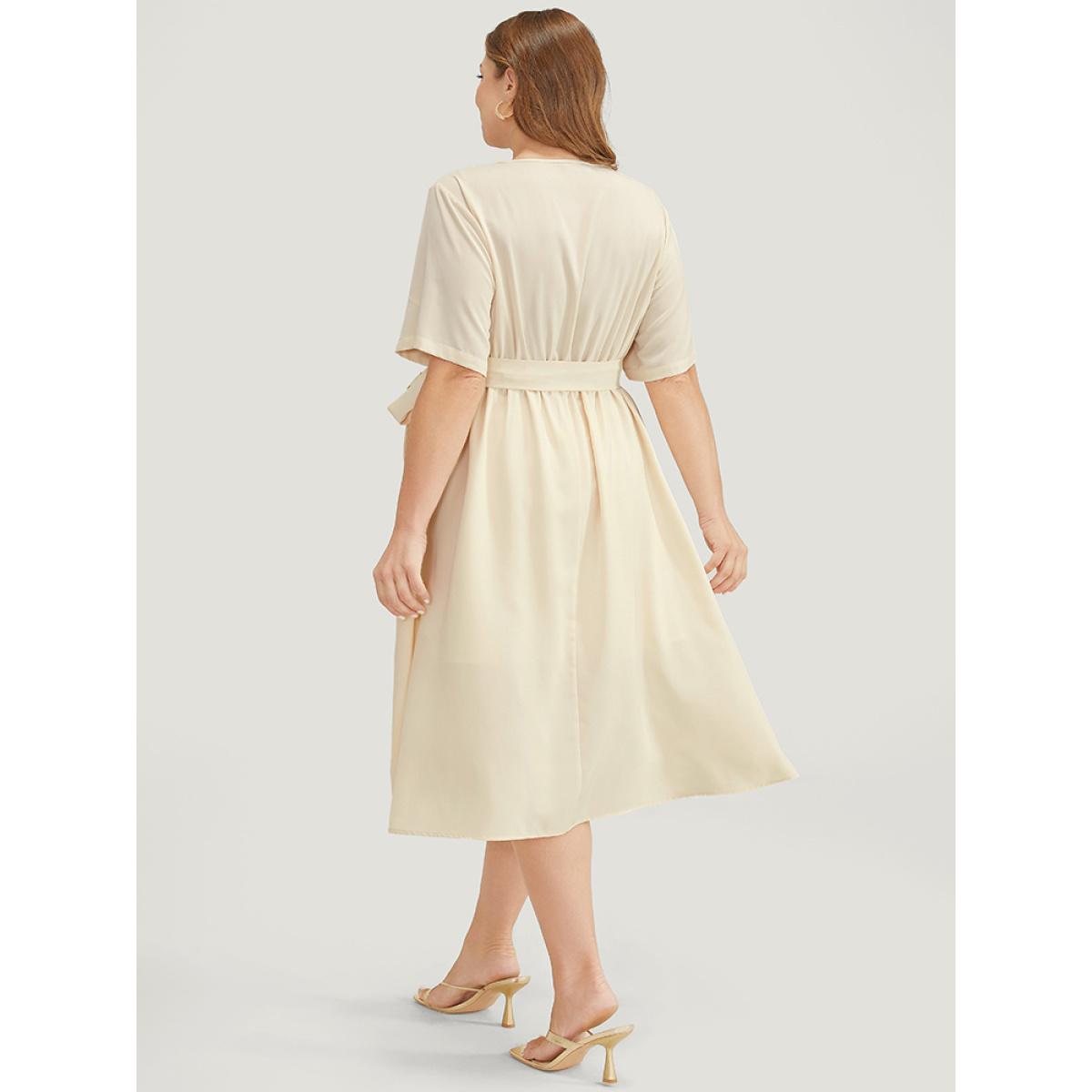 Plus Size Solid Chain Detail Cut Out Pocket Belted Flutter Dress Beige Women Office Cross straps V-neck Short sleeve Curvy Midi Dress BloomChic 30/6X Product Image