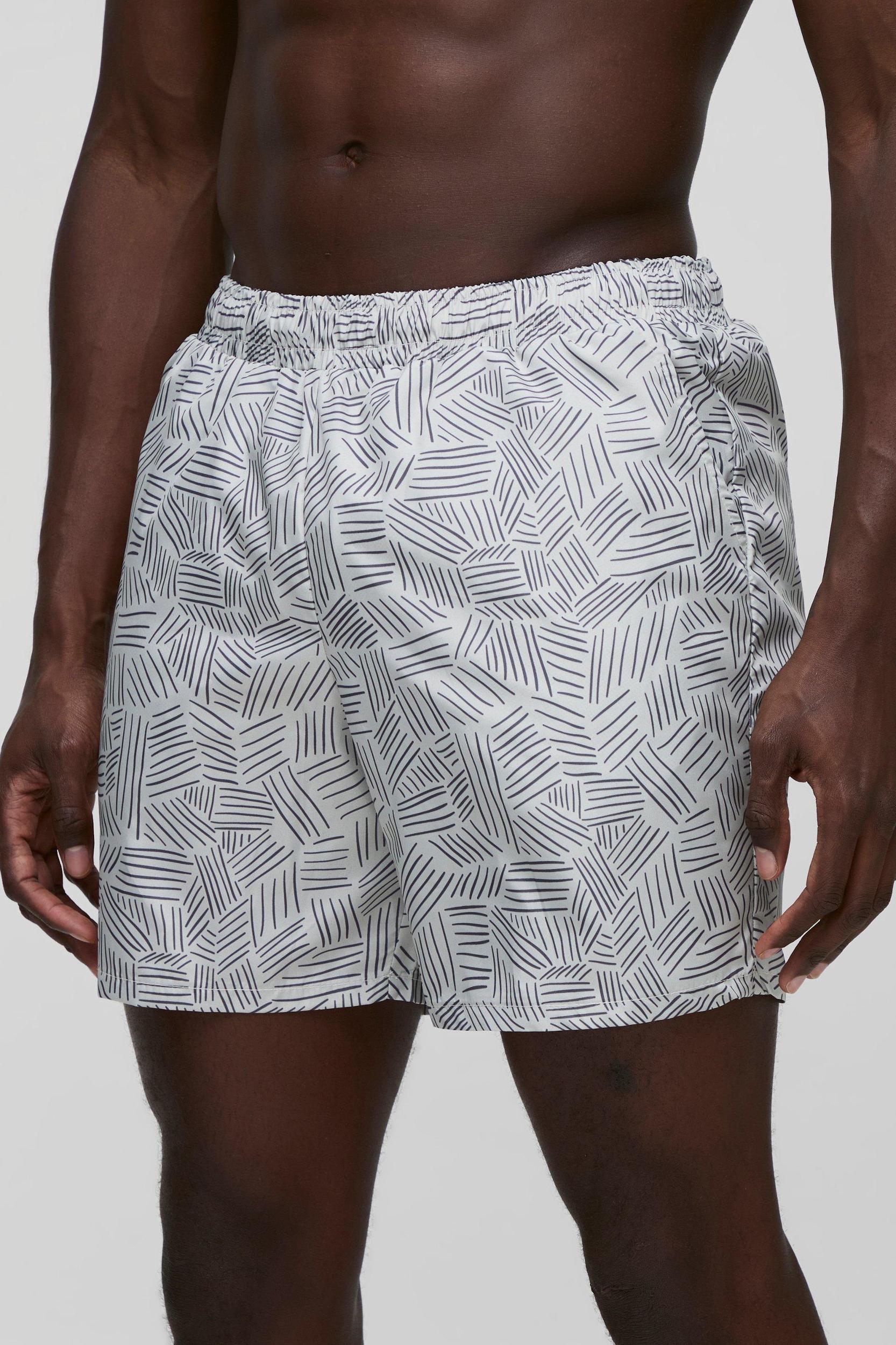 Abstract Printed Mid Length Swim Short | boohooMAN USA Product Image