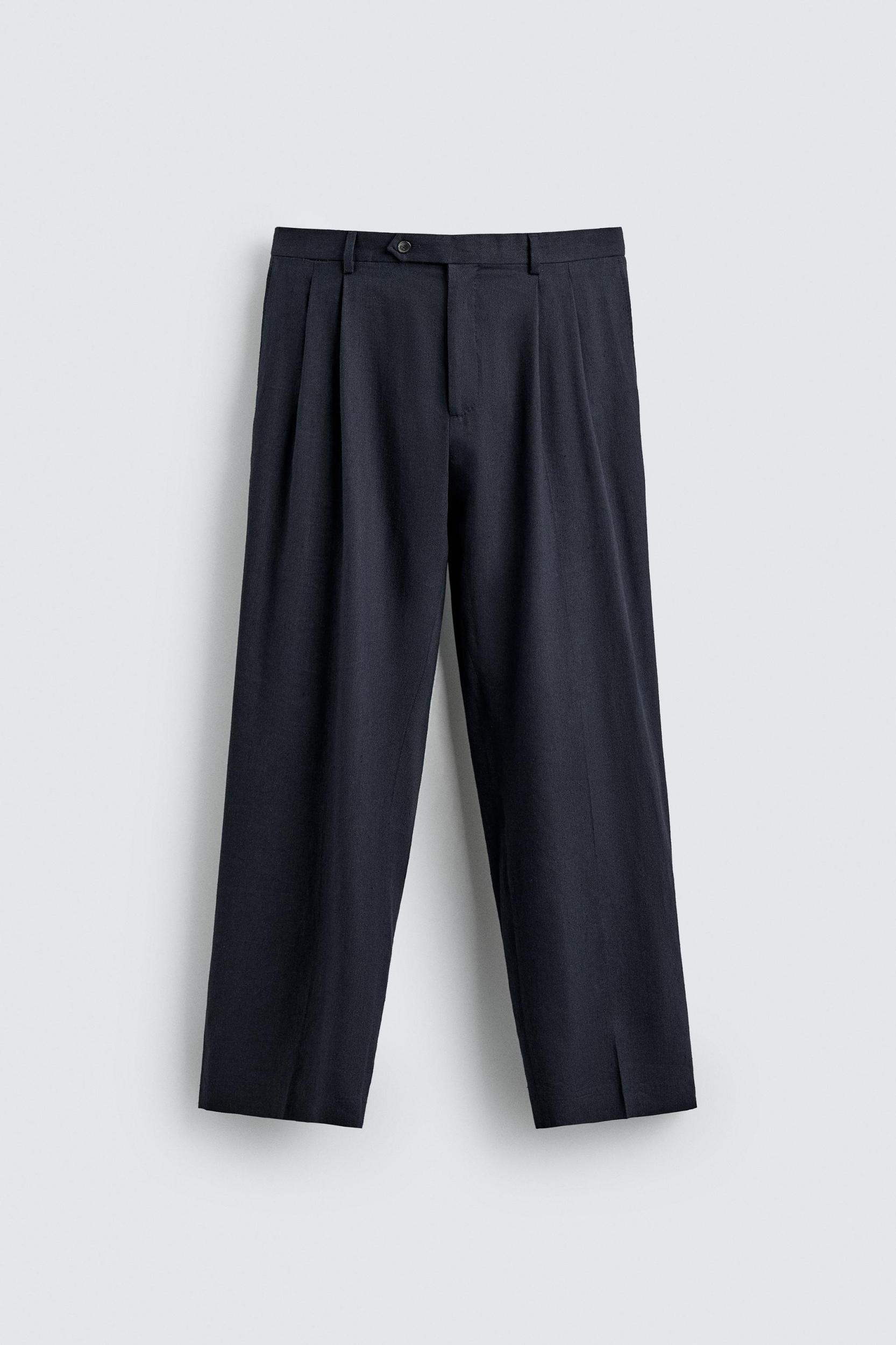 100% WOOL RELAXED FIT PLEATED PANTS Product Image