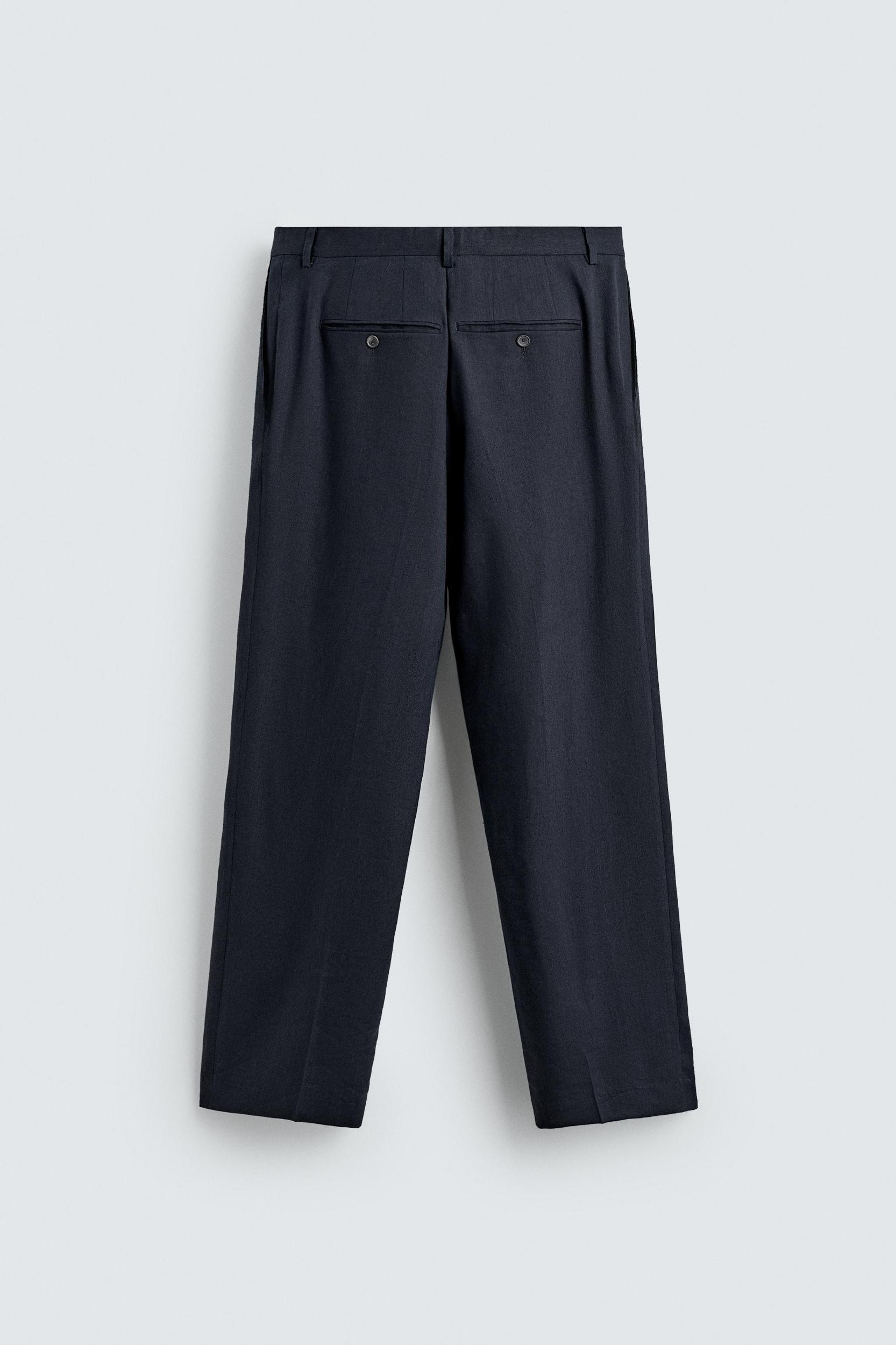 100% WOOL RELAXED FIT PLEATED PANTS Product Image