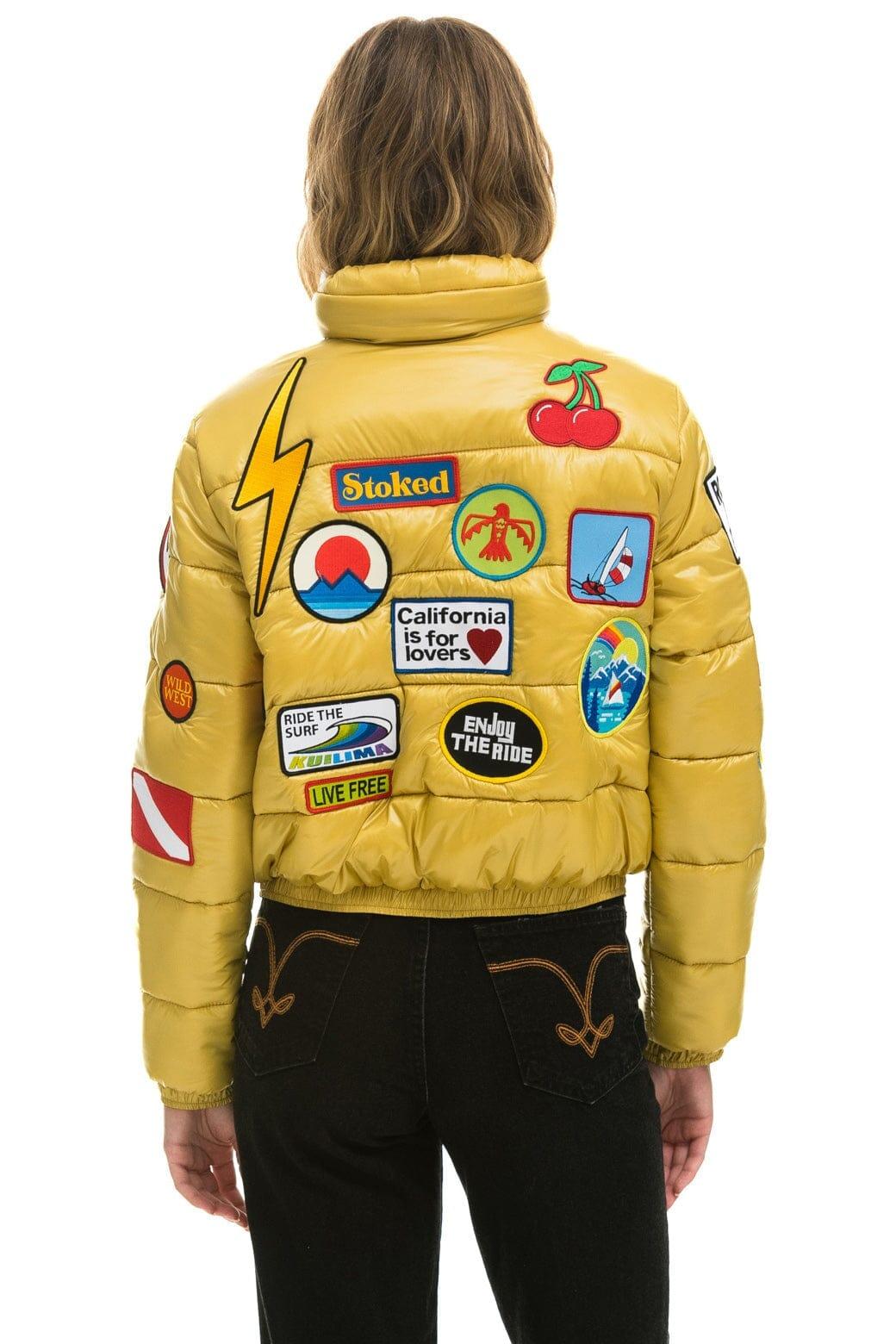 VINTAGE PATCH APRES PUFFER JACKET - HONEY GLOSSY Female Product Image