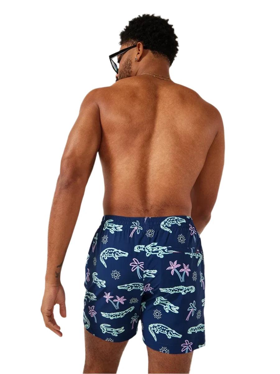 Chubbies The Neon Glades 5.5" Inseam Polyester/Spandex Swim Trunks with Mesh Brief Liner in Navy Blue Product Image