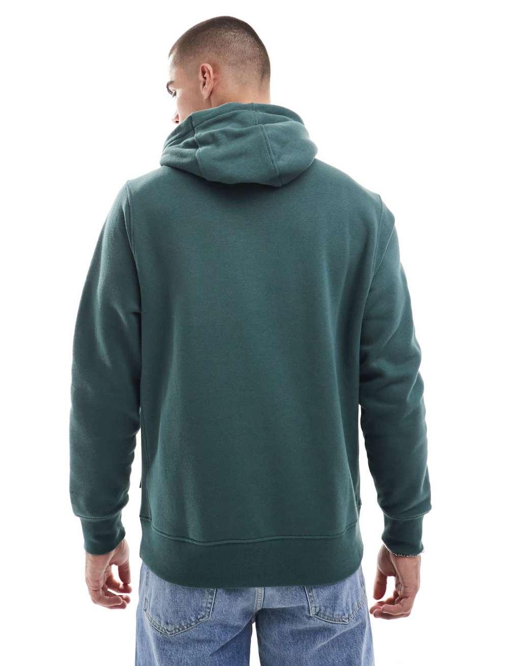 Nike 'Tis The Season logo hoodie in dark green Product Image