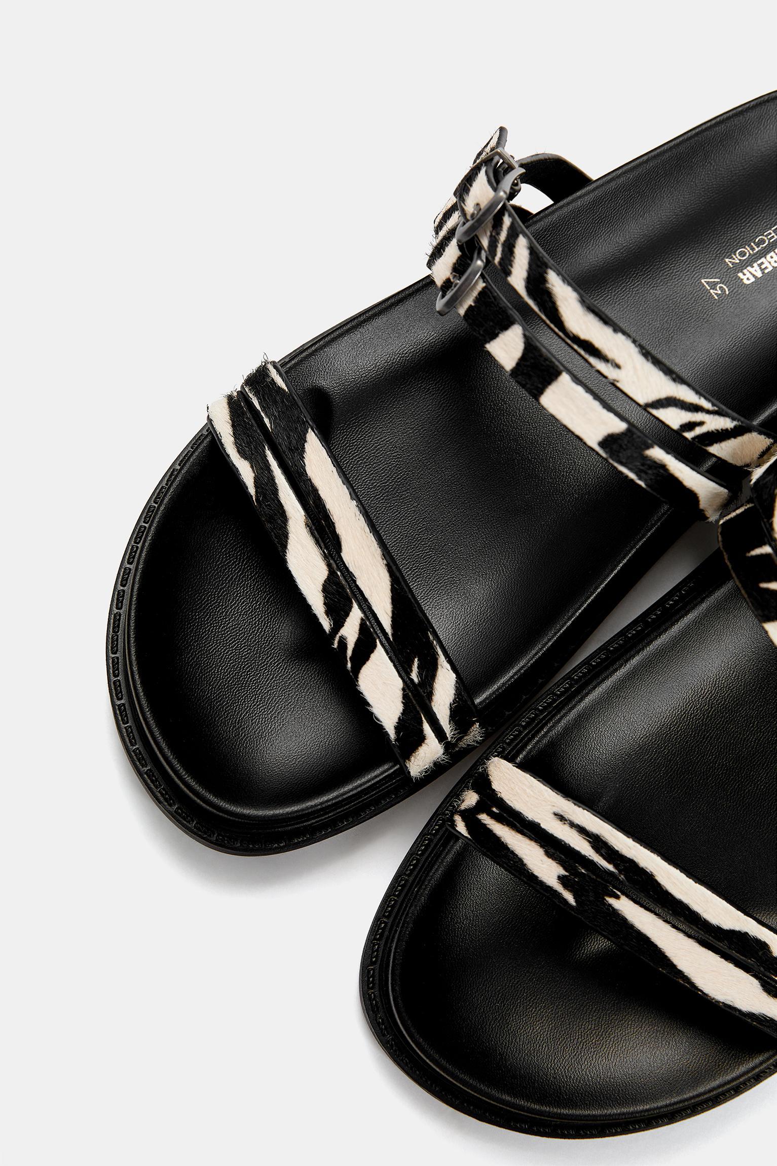 Flat leather animal print sandals Product Image