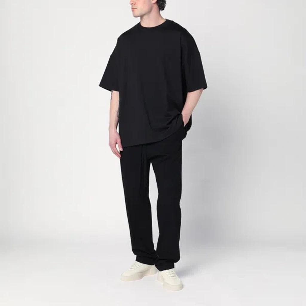 FEAR OF GOD Mens Black Logo-print Relaxed-fit Stretch-woven T-shirt Product Image