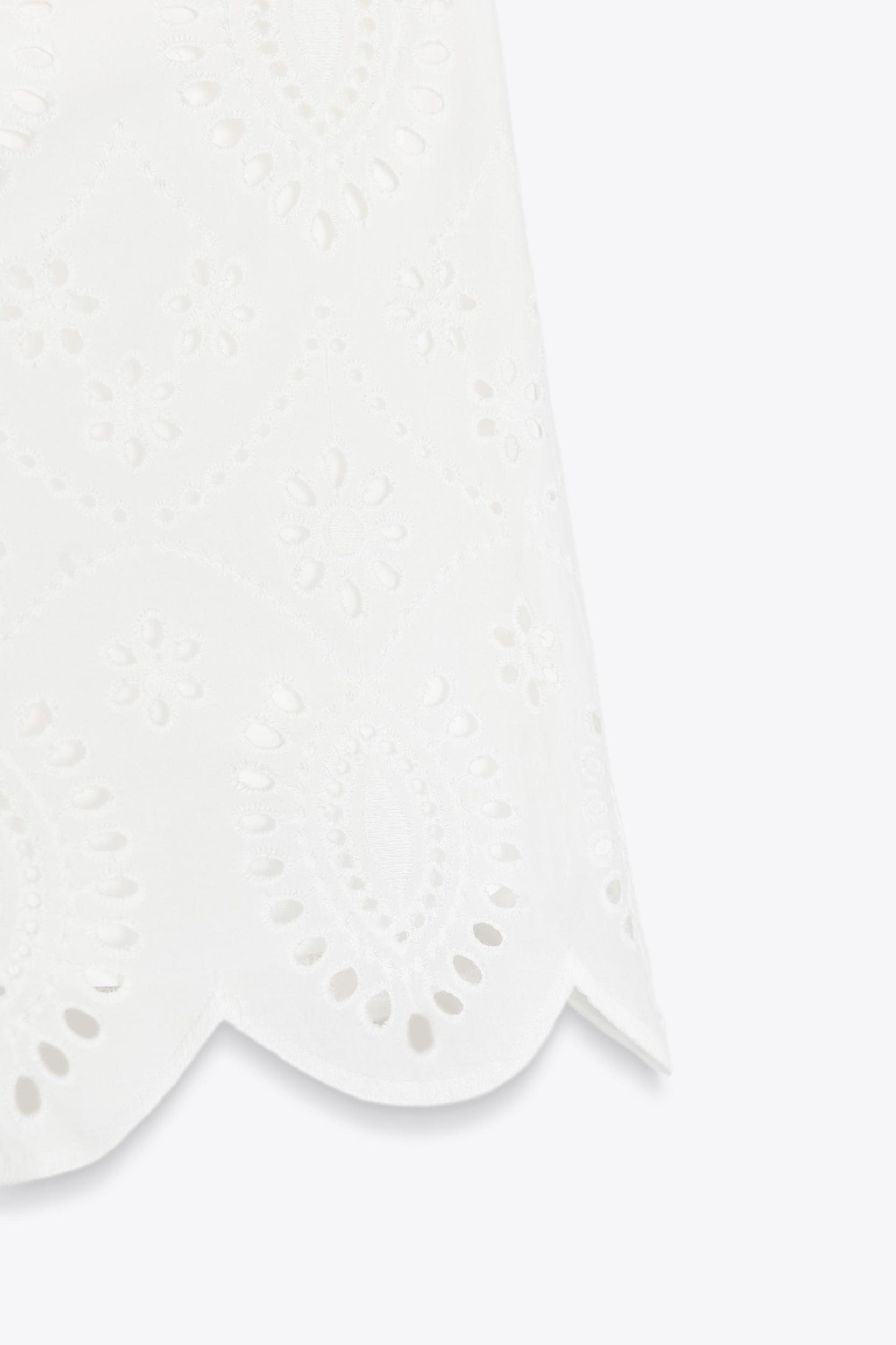 PERFORATED EMBROIDERY SHORTS Product Image