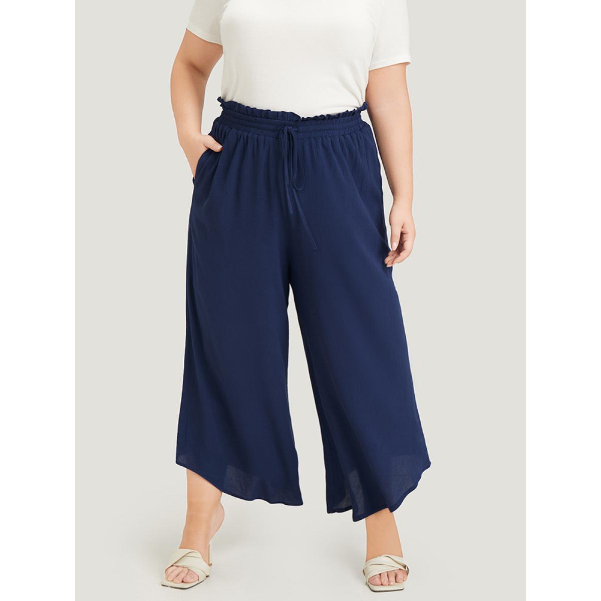 Plus Size Solid Paperbag Waist Asymmetrical Hem Wide Leg Pants Women Indigo Elegant High Rise Dailywear Pants BloomChic 12/L Product Image