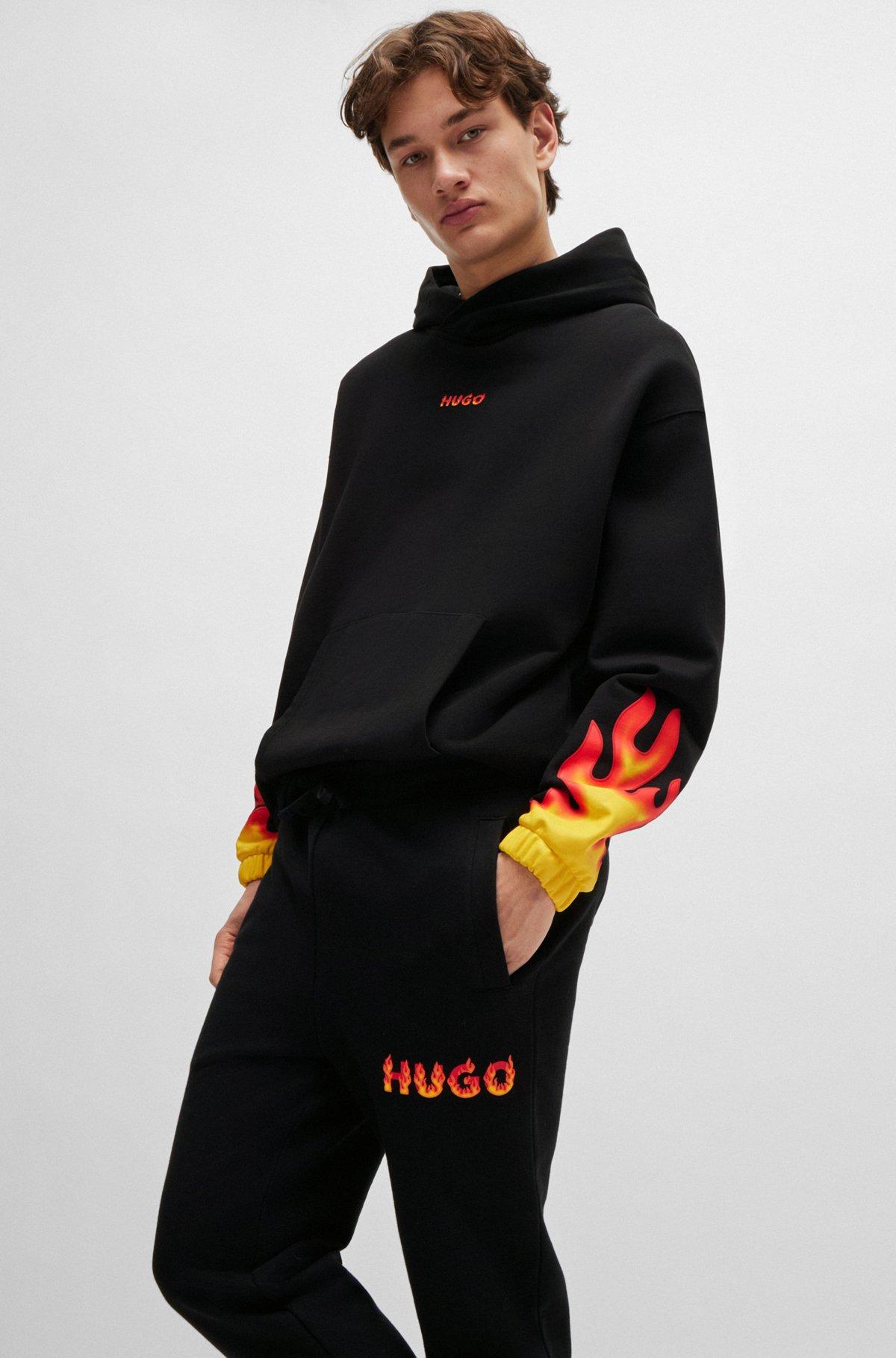 Cotton-terry tracksuit bottoms with puffed flame logo Product Image