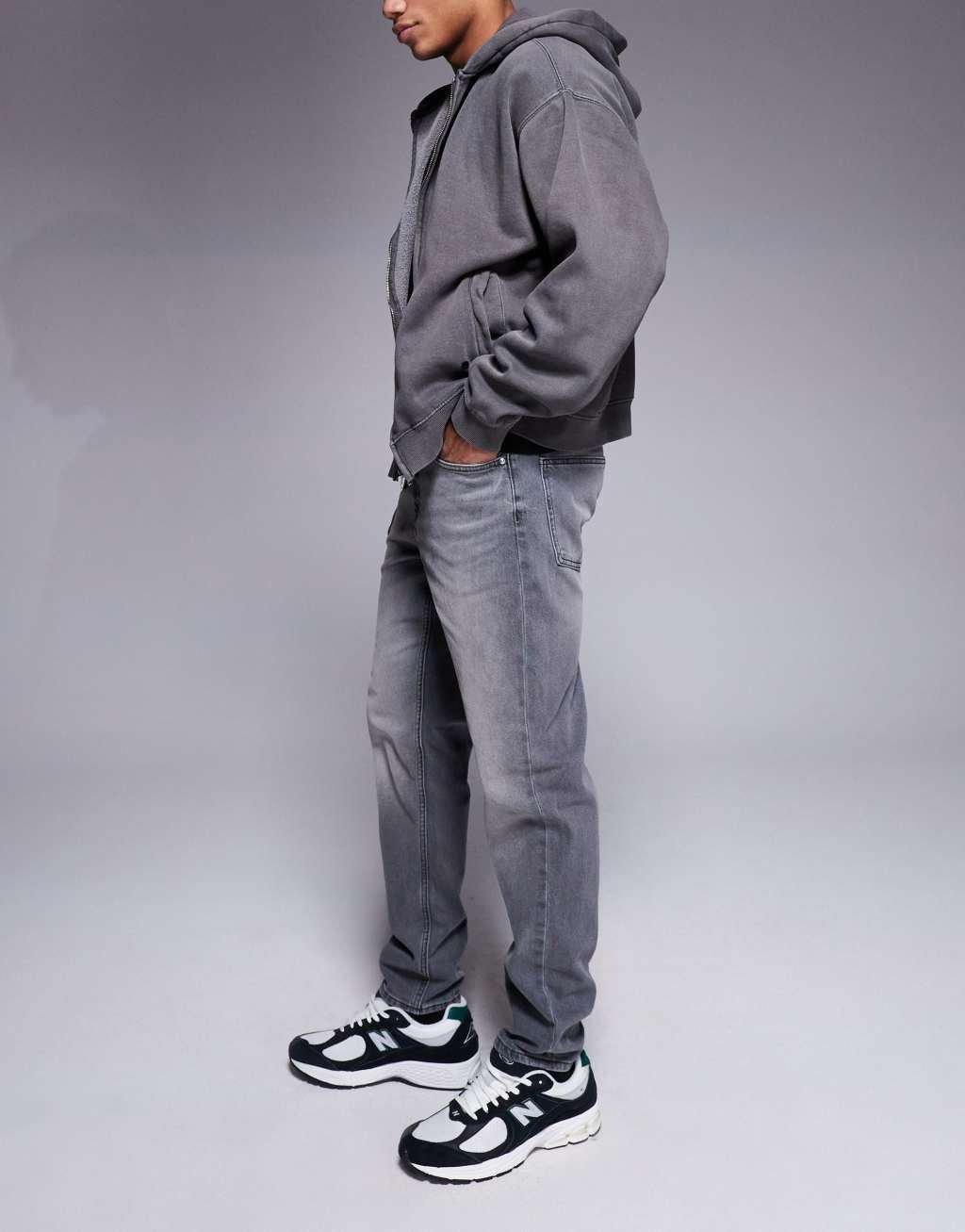 ASOS DESIGN tapered fit jeans in washed black  Product Image