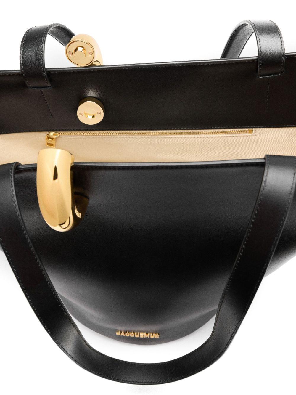 JACQUEMUS The Medium Bambola Asymmetric Leather Bucket Bag In Black 990 Product Image
