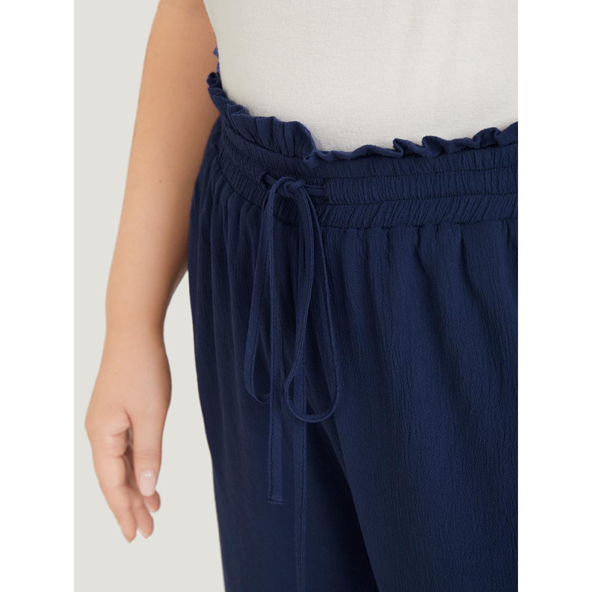 Plus Size Solid Paperbag Waist Asymmetrical Hem Wide Leg Pants Women Indigo Elegant High Rise Dailywear Pants BloomChic 12/L Product Image