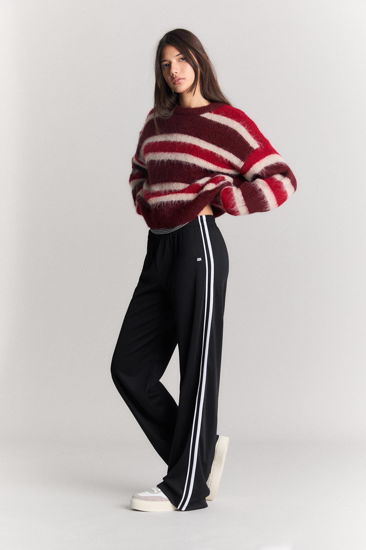 Tracksuit pants with side stripes Product Image