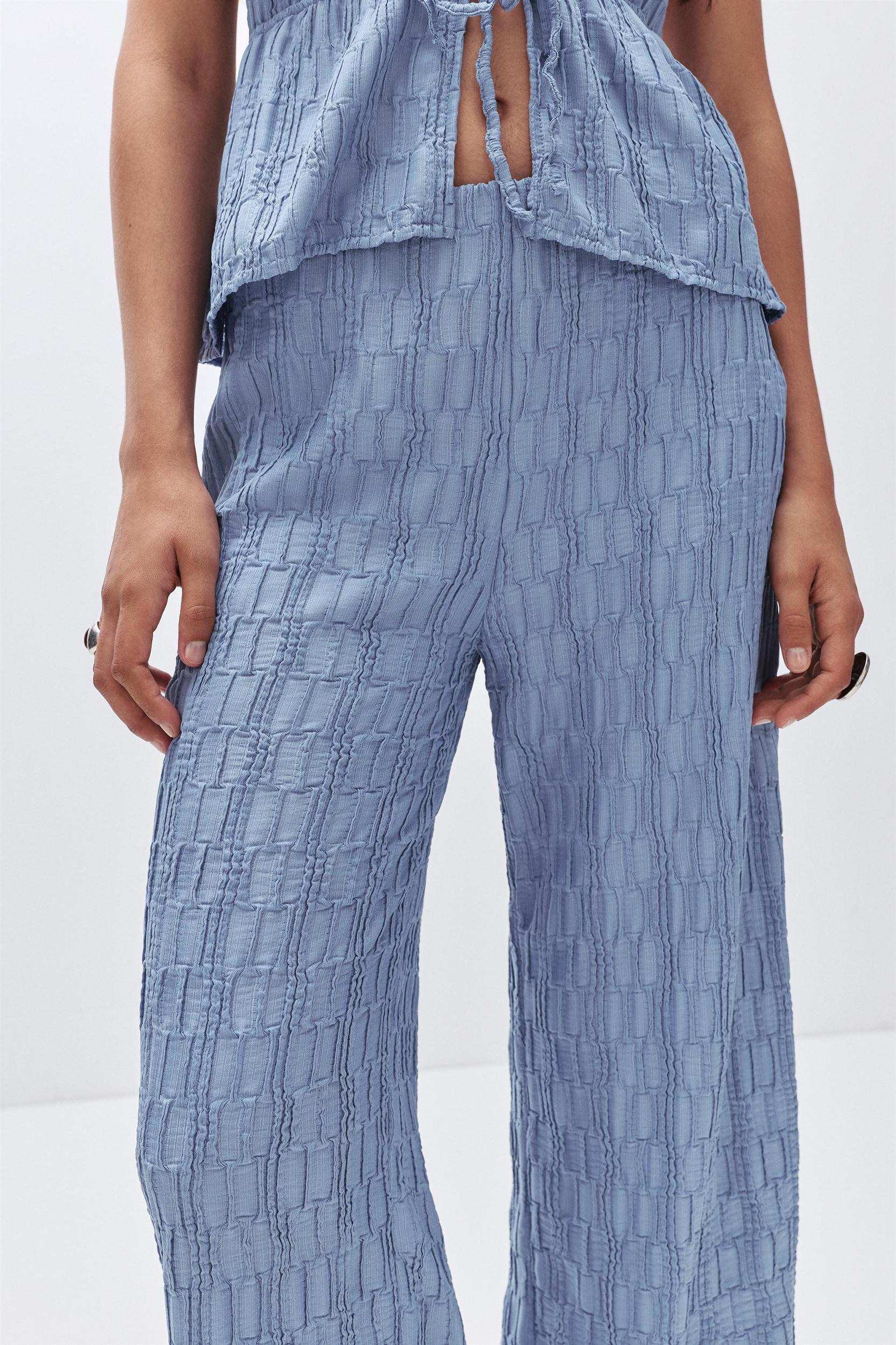 Textured bell bottom trousers Product Image