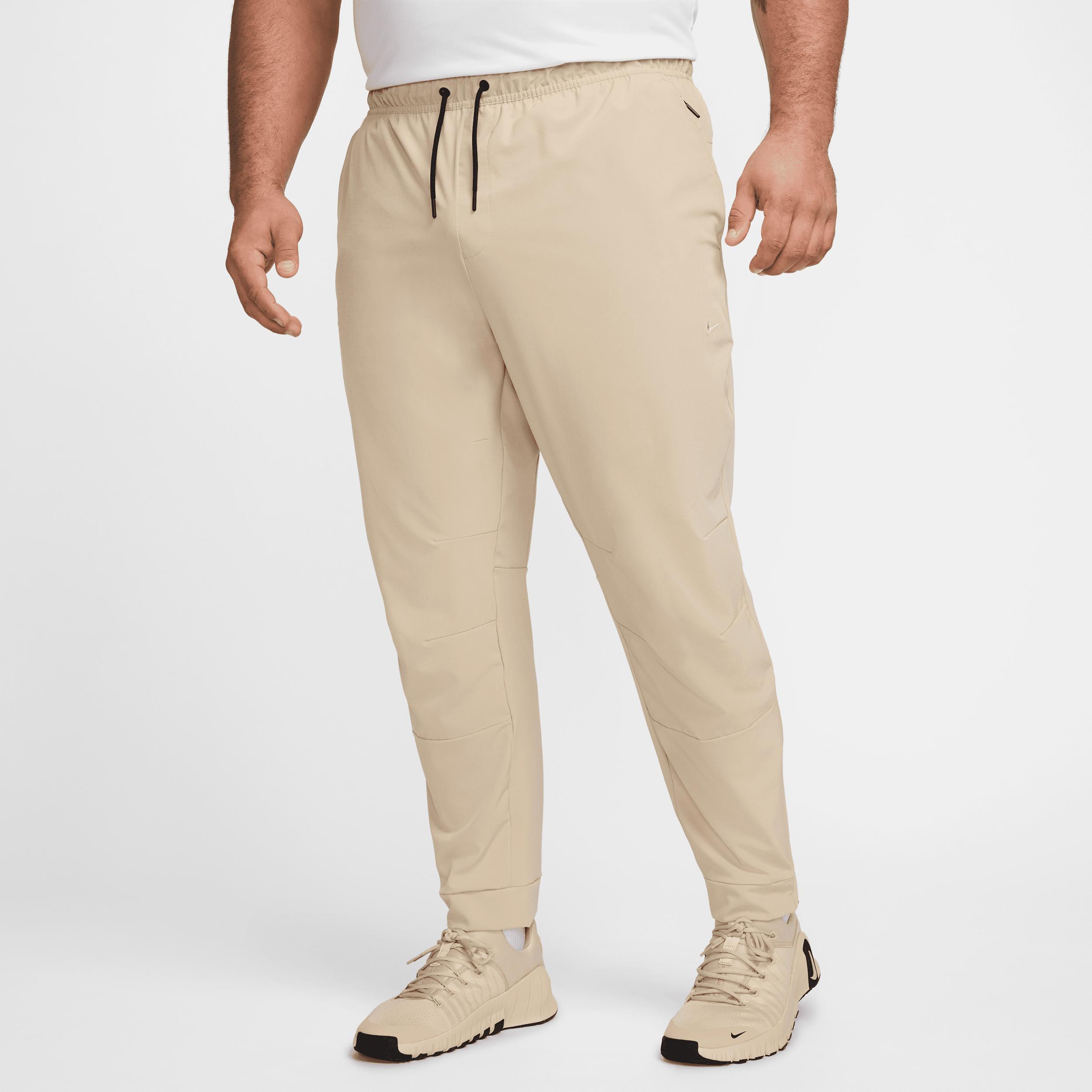 Nike Mens Unlimited Dri-FIT Zippered Cuff Versatile Pants | FB7548-320 Product Image