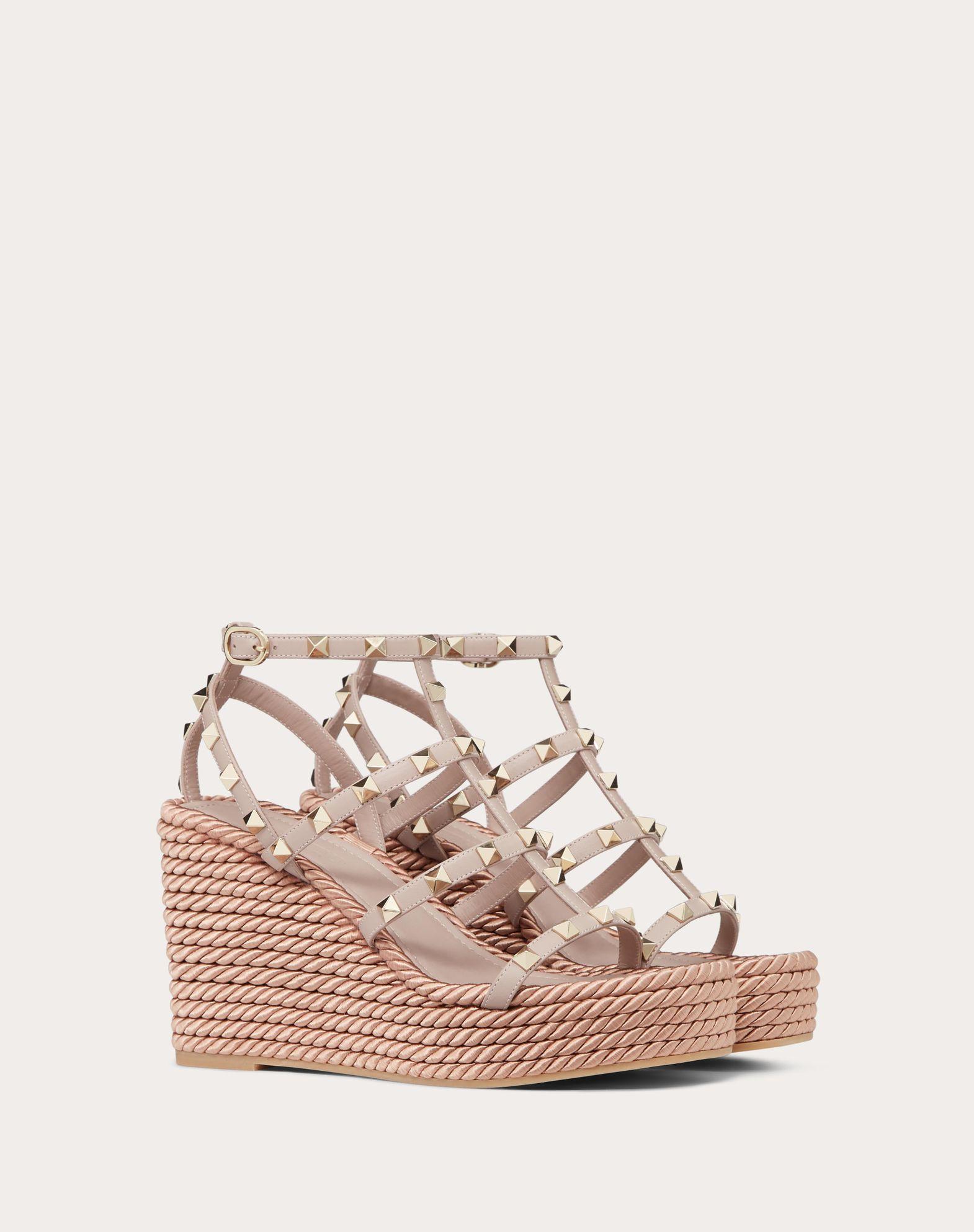ROCKSTUD ANKLE STRAP WEDGE SANDAL IN CALFSKIN LEATHER 95 MM Product Image