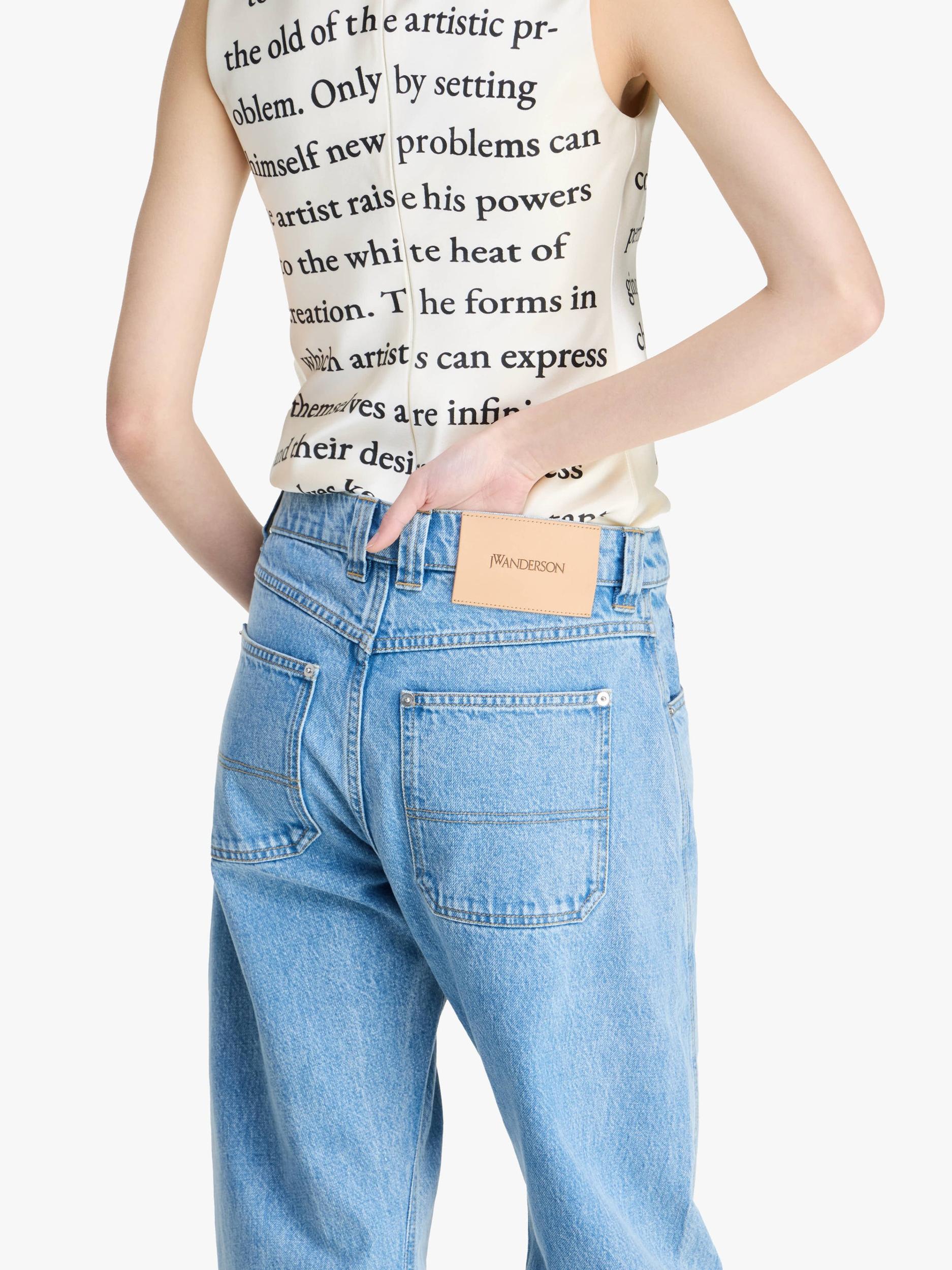 TWISTED SLIM LEG DENIM JEANS Product Image