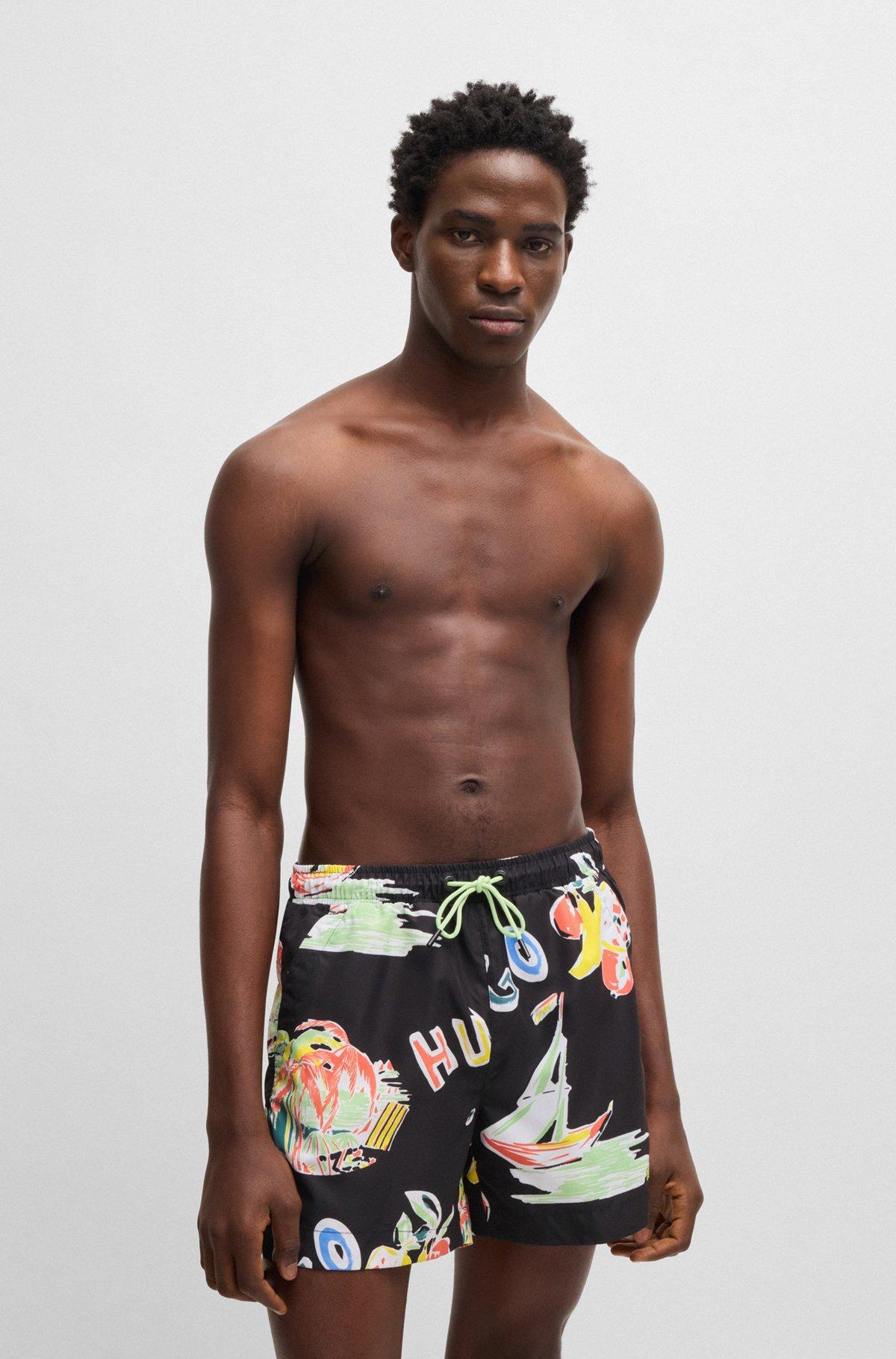 HUGO - Fully lined swim shorts with seasonal print - Black Product Image
