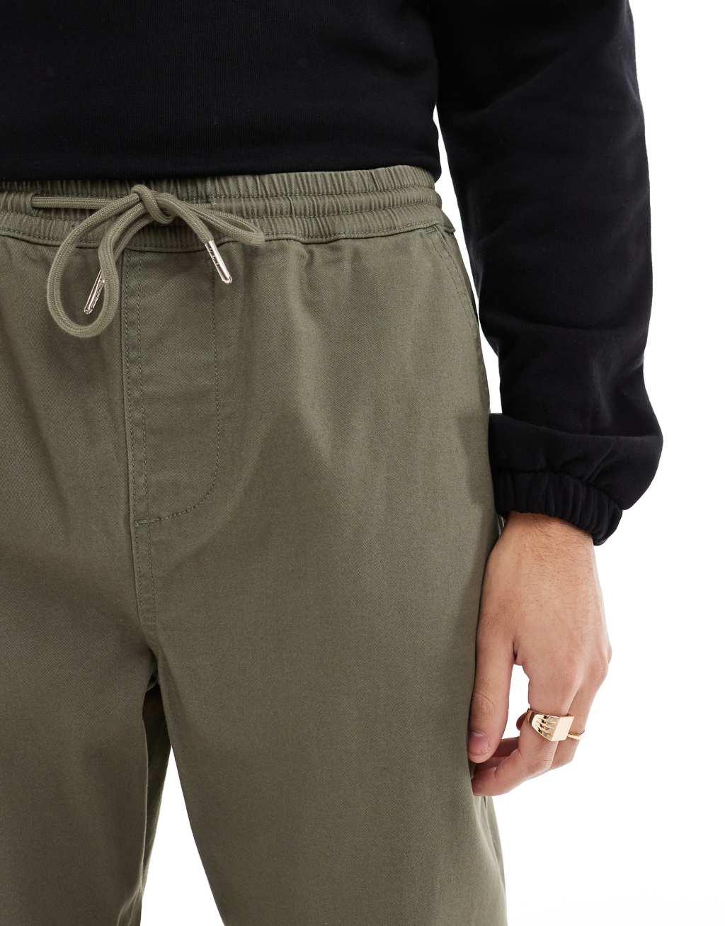 ASOS DESIGN tapered pull on chino with elastic waist in khaki Product Image