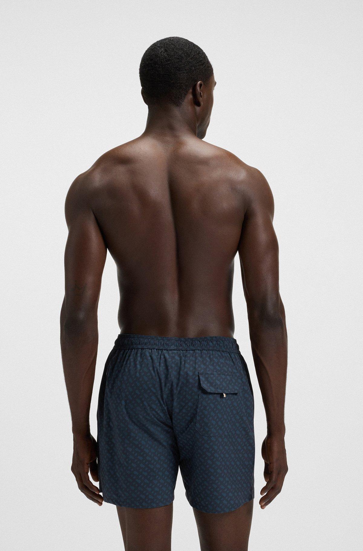 Logo-badge swim shorts with degradé monogram print Product Image