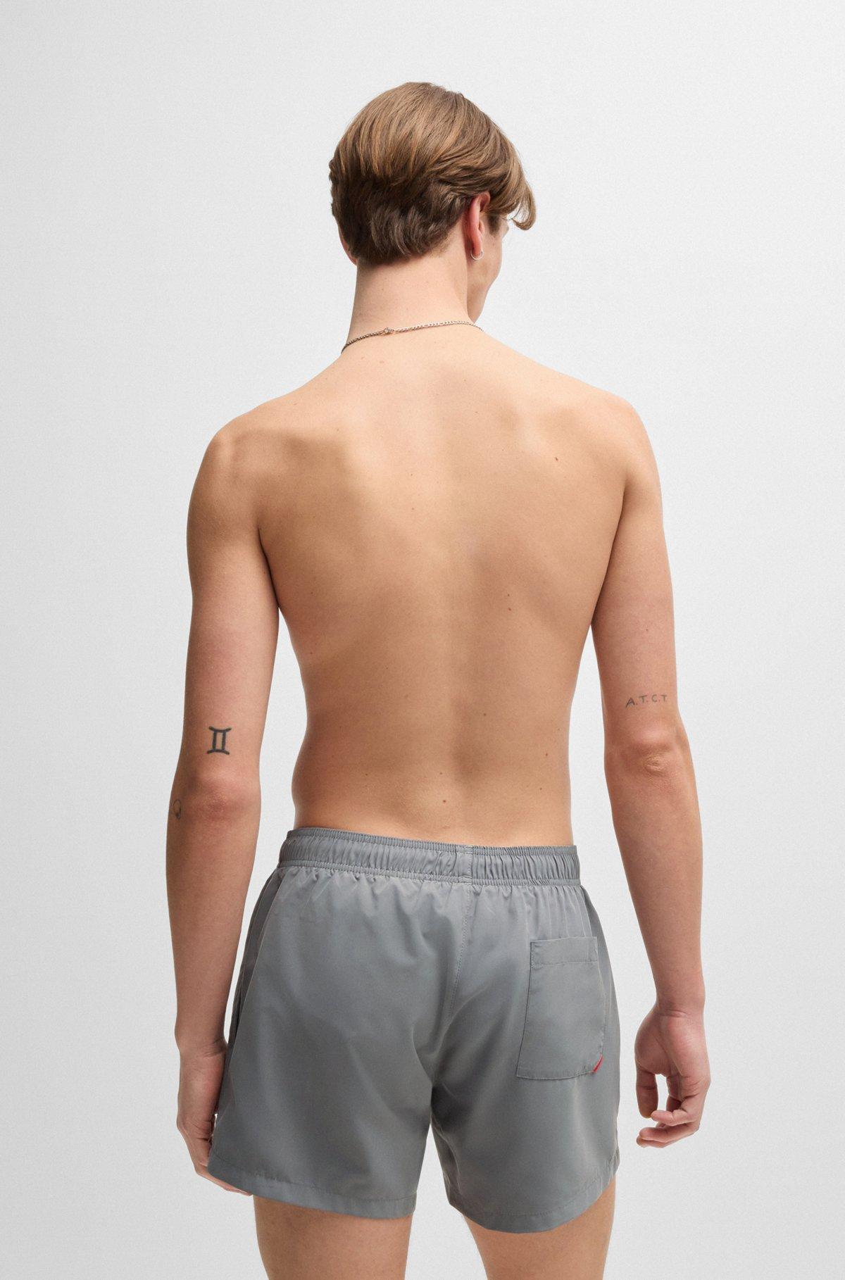 Fully lined swim shorts with vertical logo Product Image