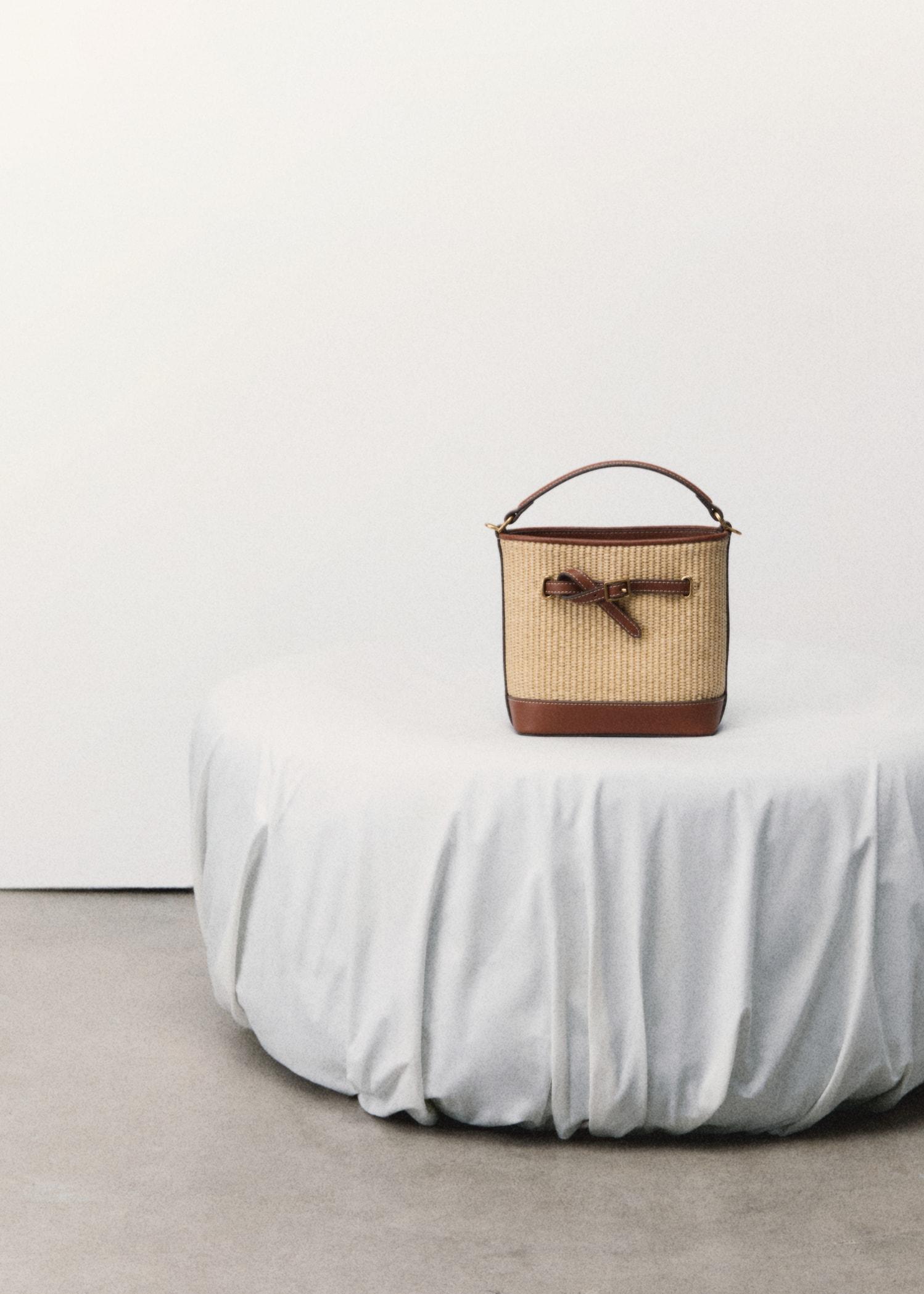 Raffia-effect bucket bag - Women | MANGO USA Product Image