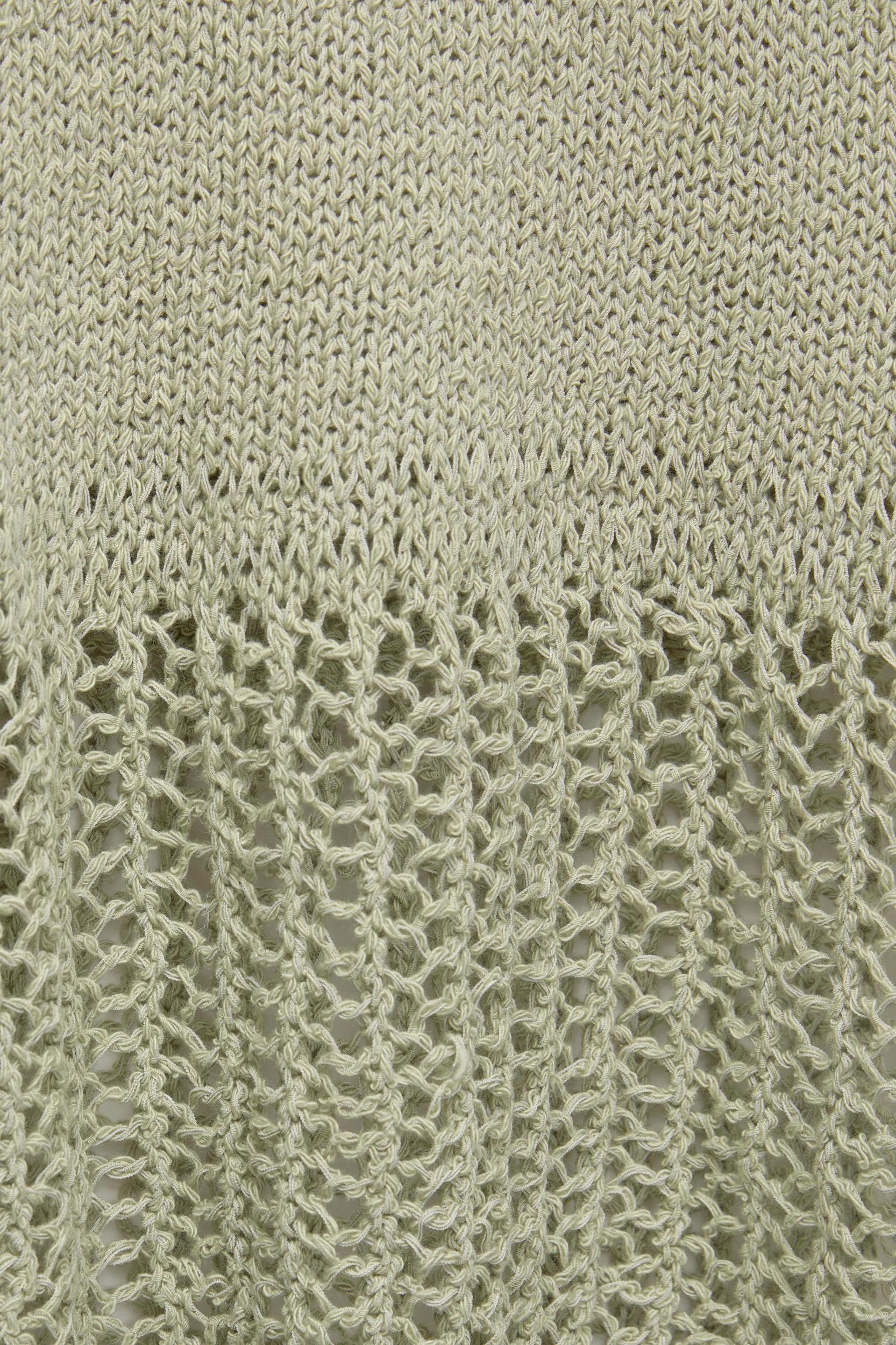 Knit top with an open knit hem Product Image
