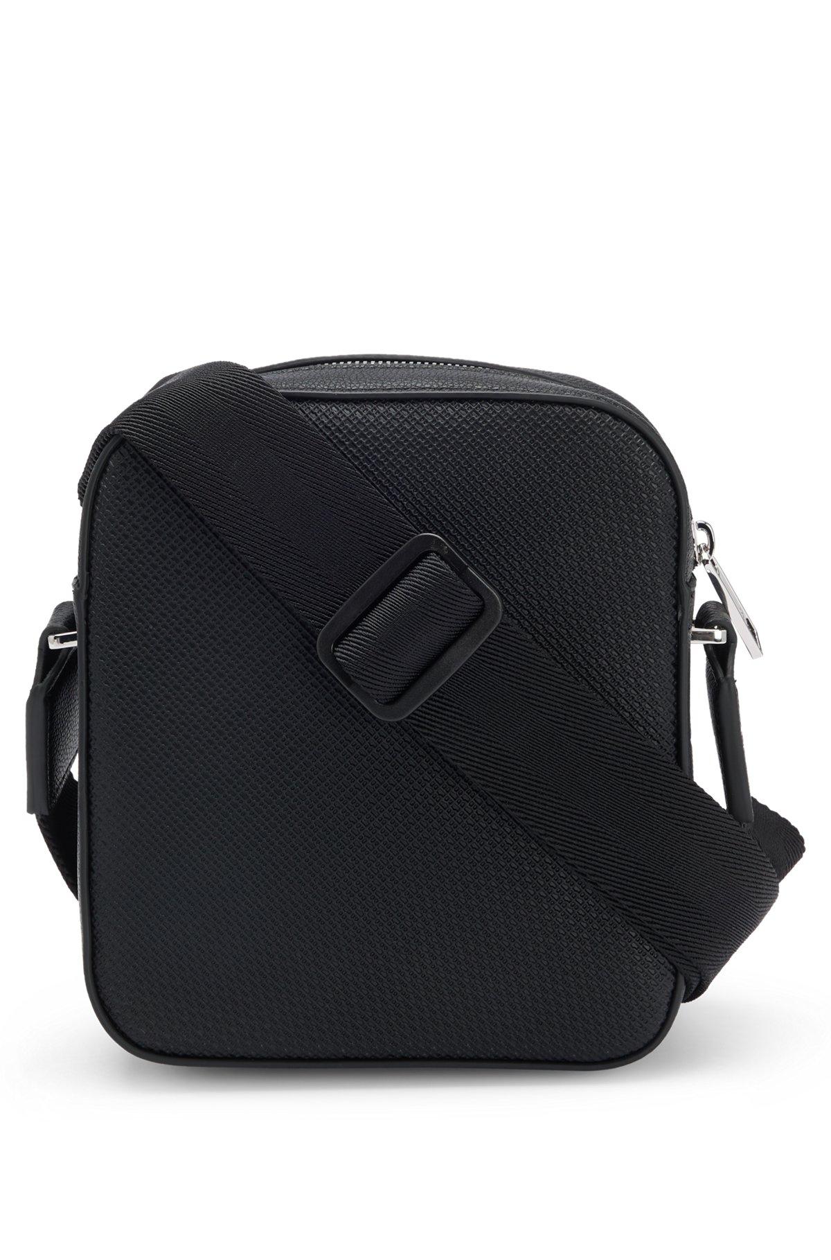 Reporter bag in faux leather with monogram-embossed panels Product Image