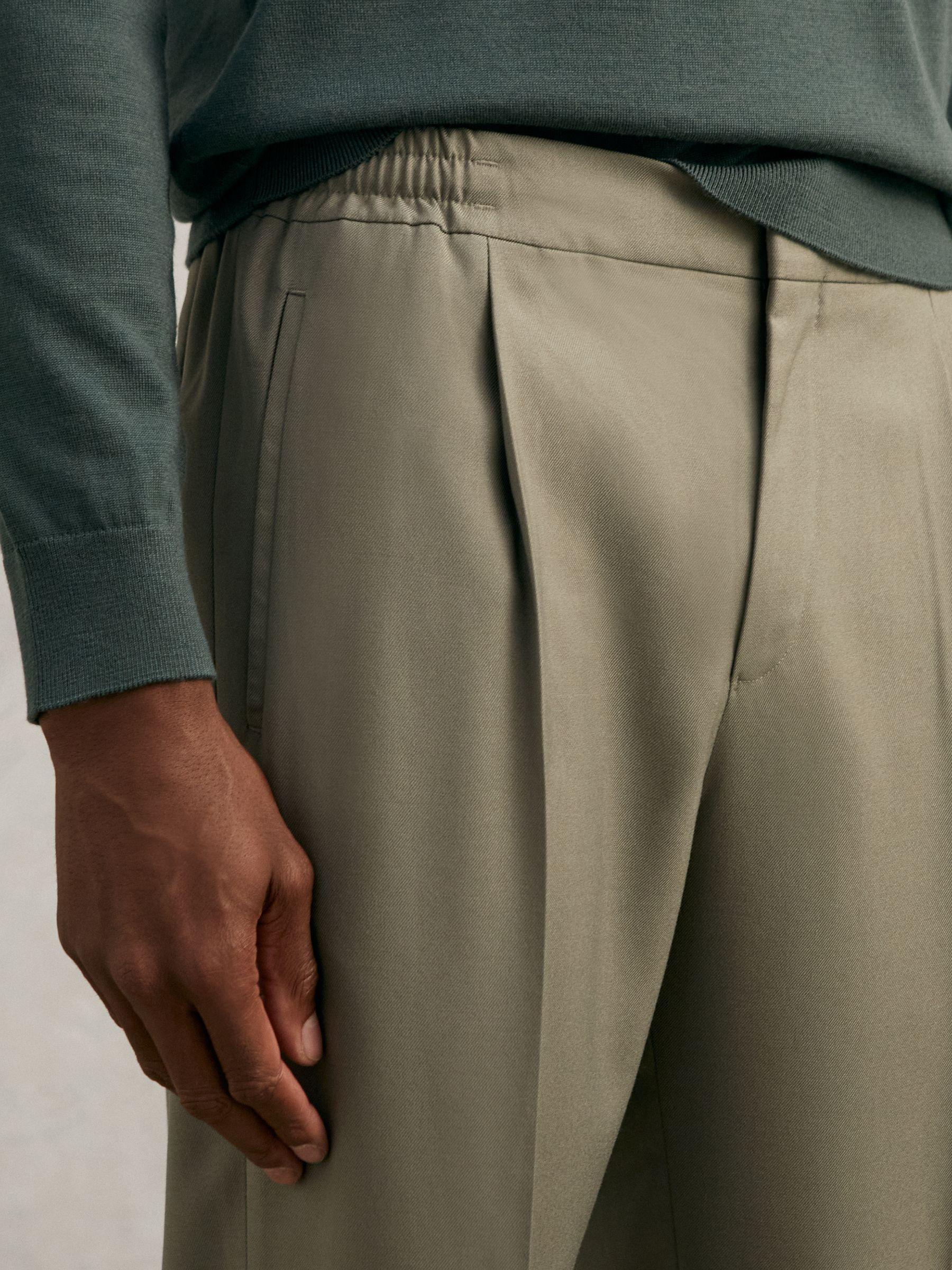 Relaxed-Fit Pleated Tapered Trousers in Sage Product Image