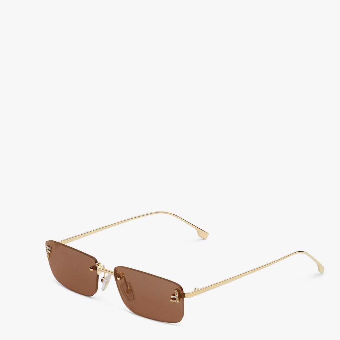 Fendi First CrystalGold-colored sunglasses with gray lenses Product Image