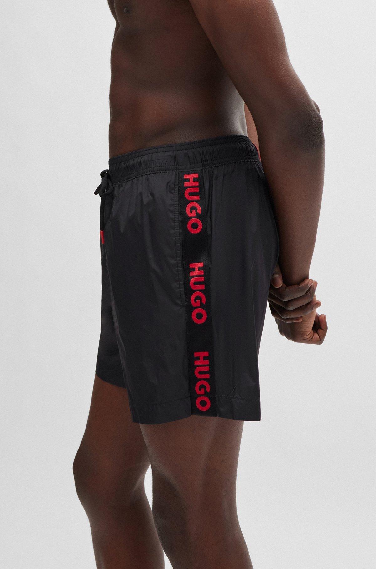 Fully lined swim shorts with logo tape Product Image