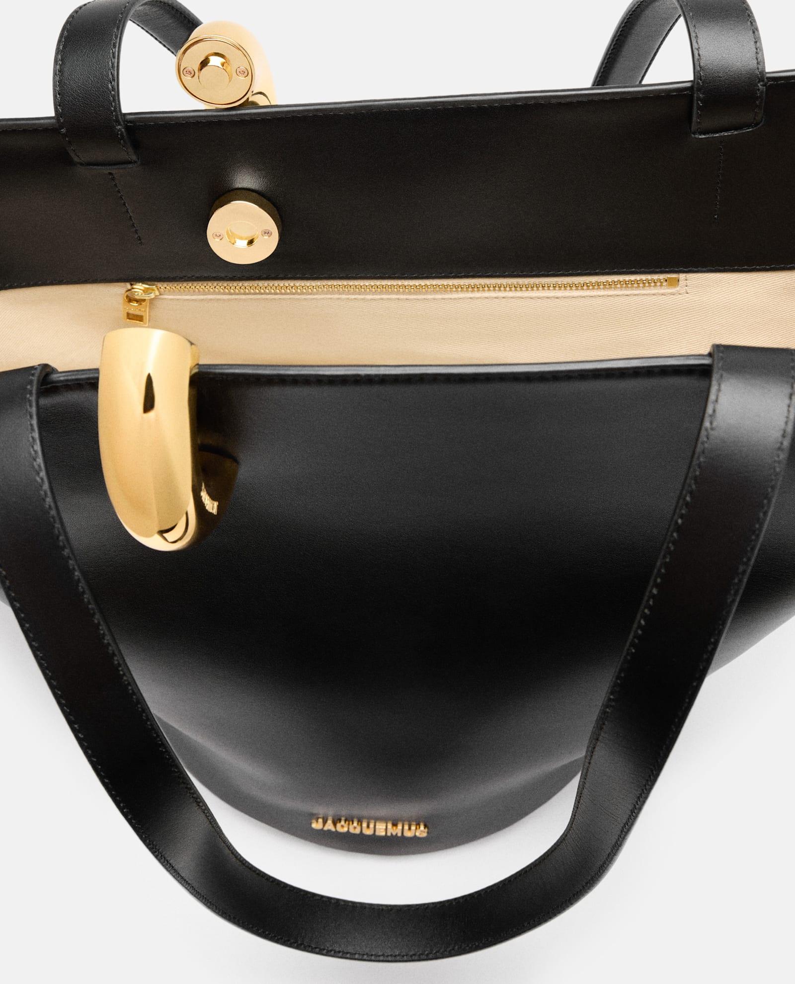 JACQUEMUS The Medium Bambola Asymmetric Leather Bucket Bag In Black 990 Product Image
