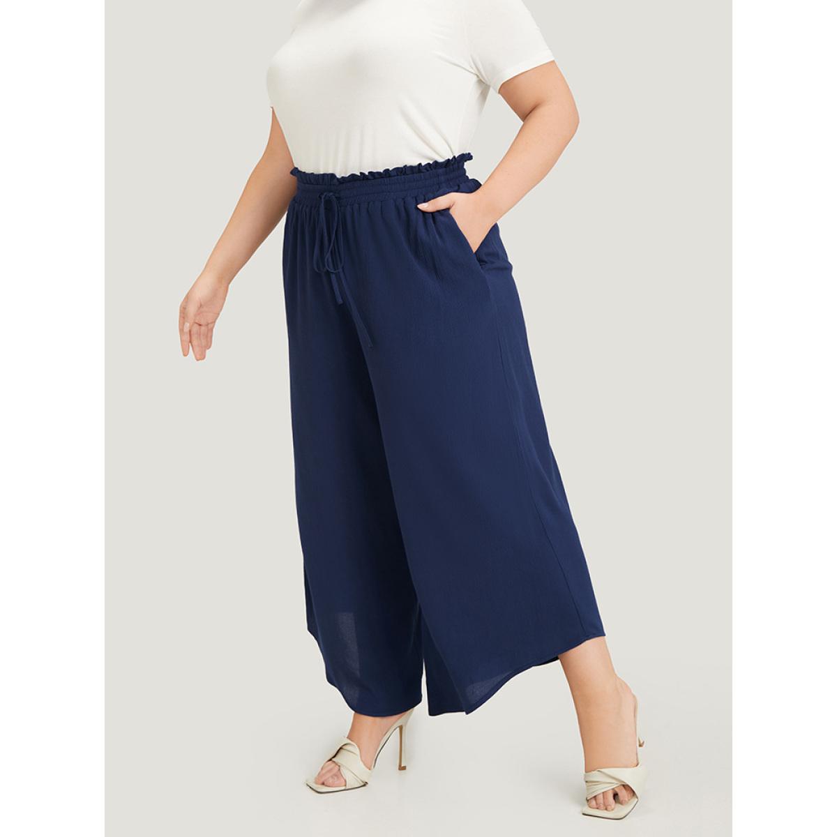 Plus Size Solid Paperbag Waist Asymmetrical Hem Wide Leg Pants Women Indigo Elegant High Rise Dailywear Pants BloomChic 12/L Product Image