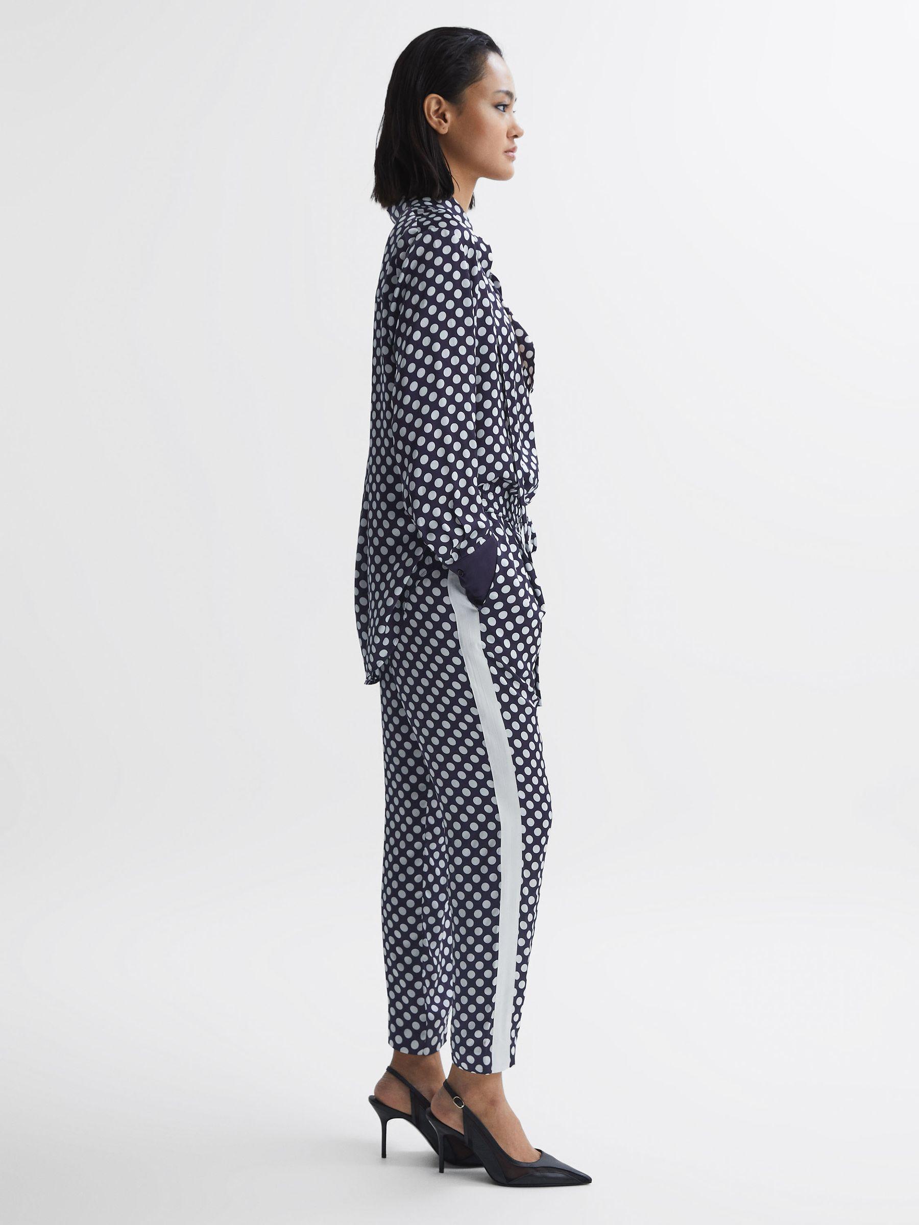 Polka Dot Drawstring Tapered Trousers in Navy/White Product Image