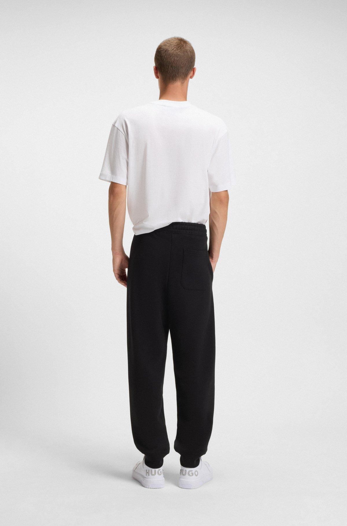 Cotton-terry tracksuit bottoms with logo print Product Image