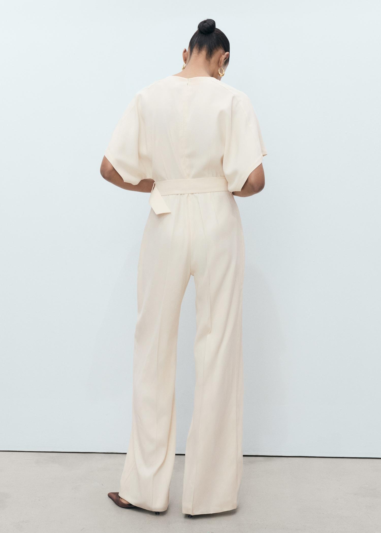 Long jumpsuit with belt and buckle - Women | MANGO USA Product Image