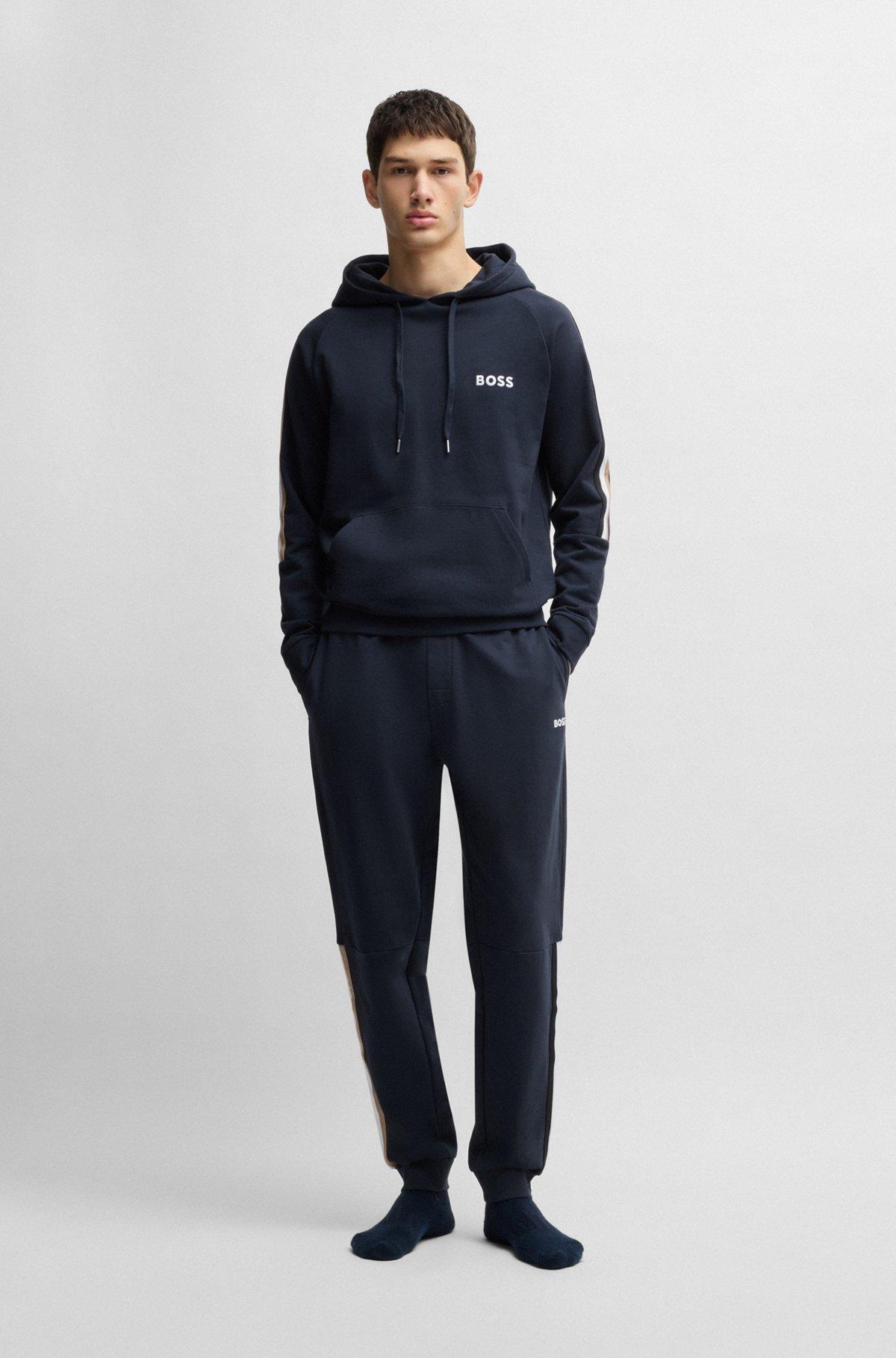 Cotton-terry tracksuit bottoms with tape inserts Product Image