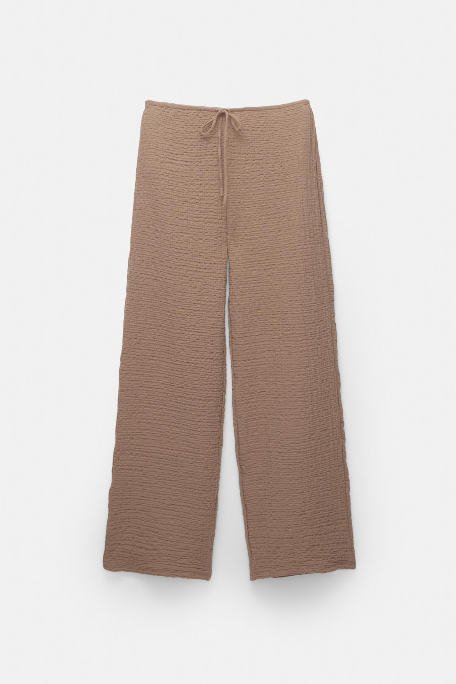 Rustic creased-effect pants Product Image