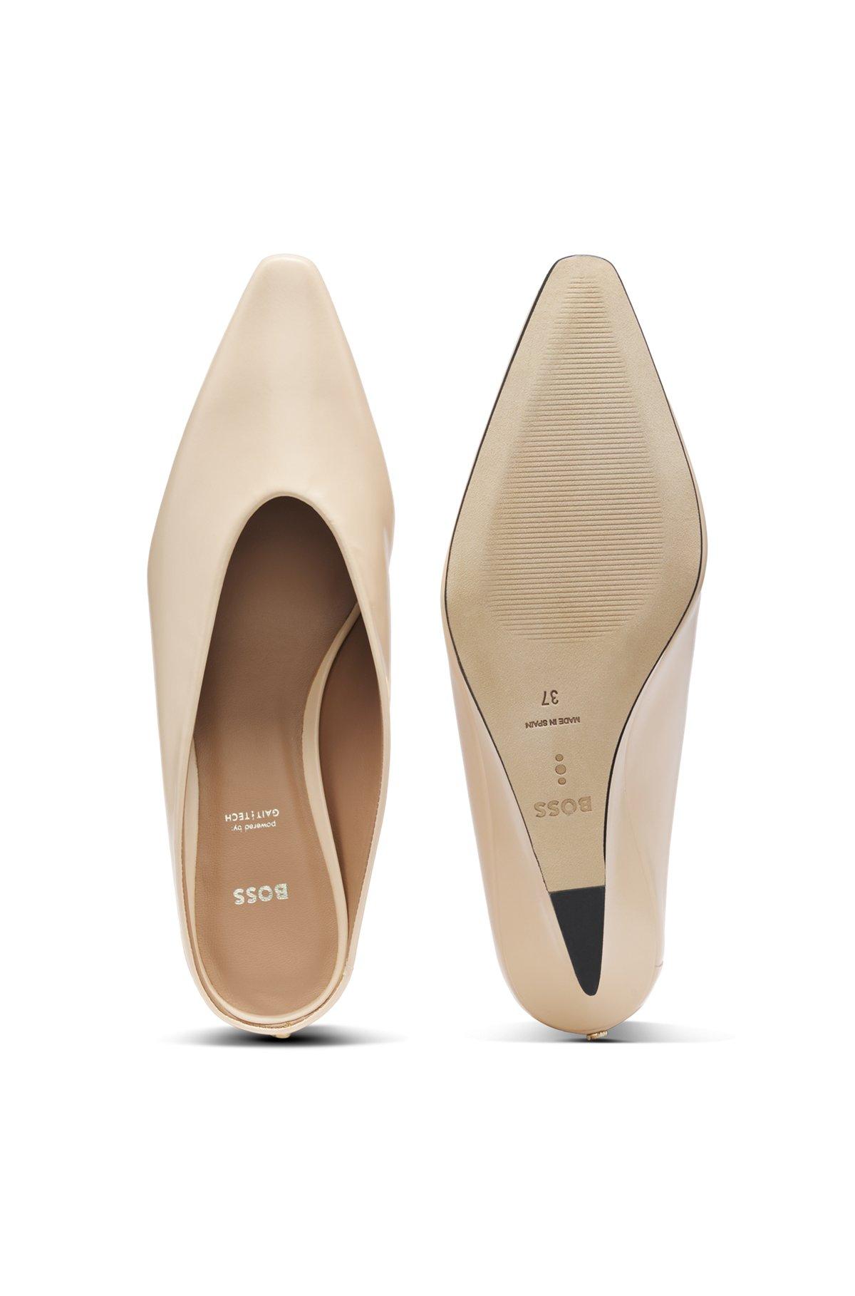 Wedge-heel mules in leather Product Image