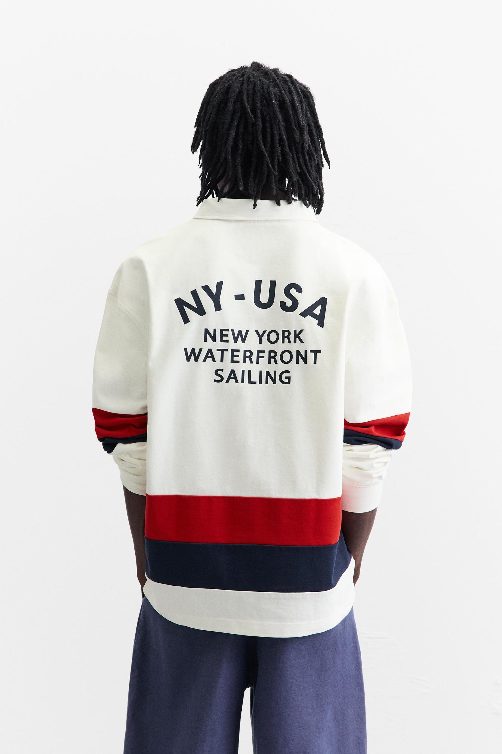 POLO WITH CONTRASTING SIDE STRIPE Product Image