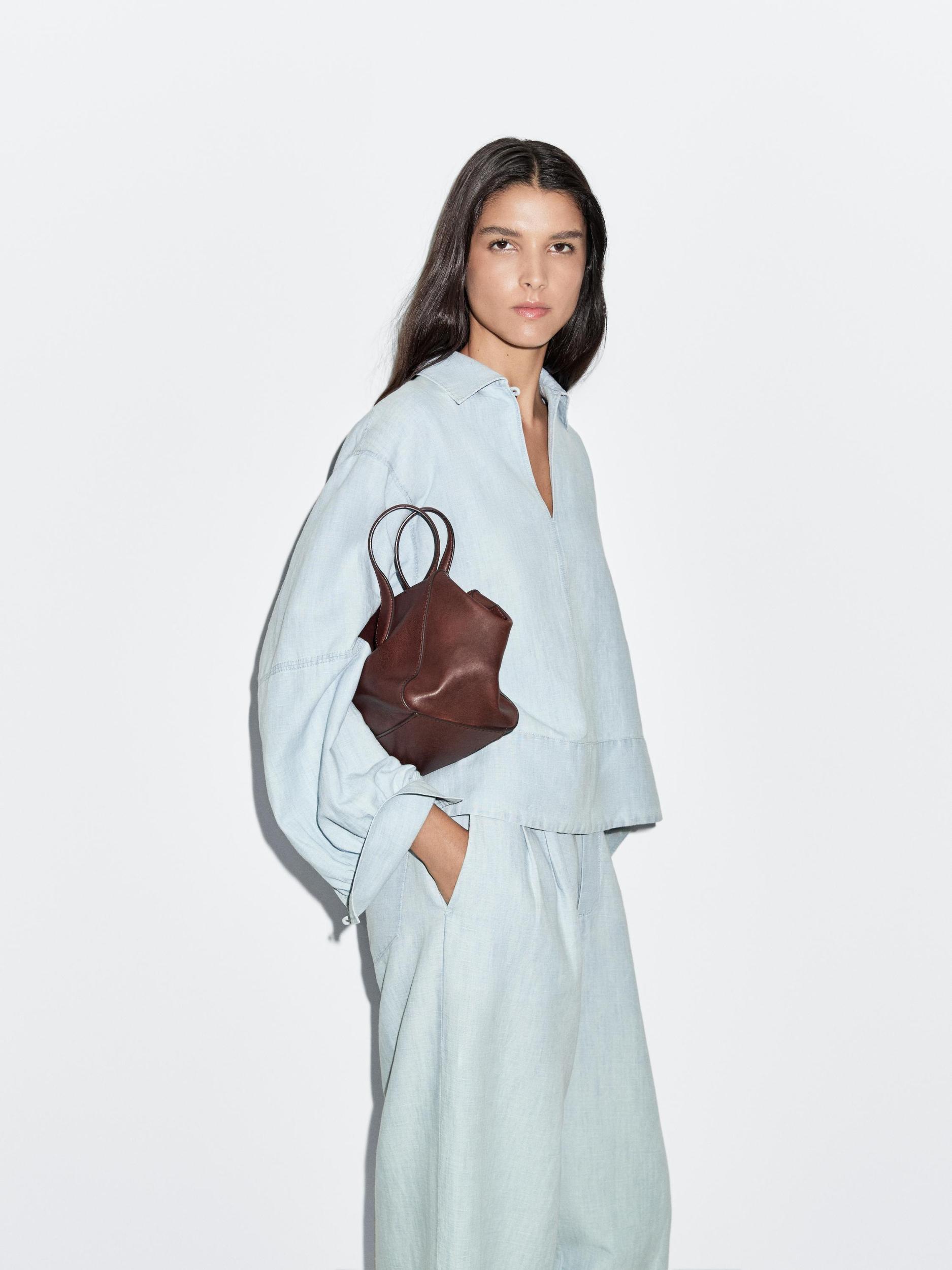 Oversize denim blouse with puff sleeves Product Image