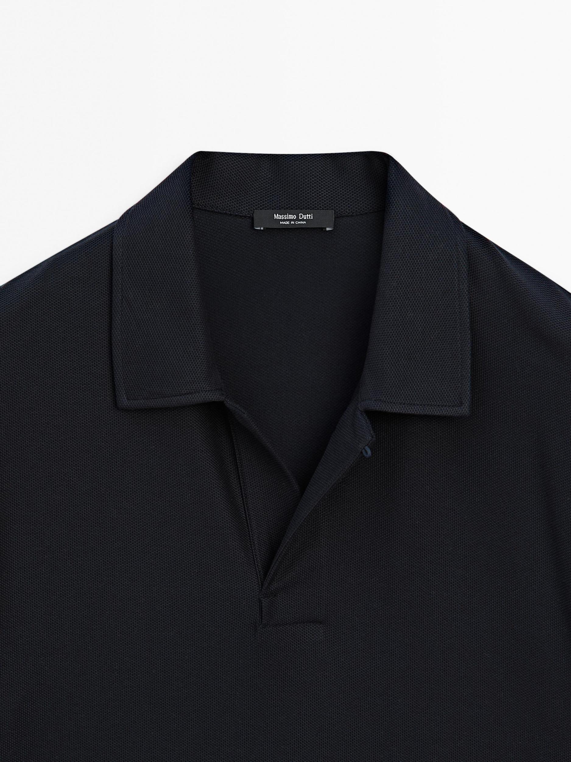 Textured polo shirt with hidden button Product Image