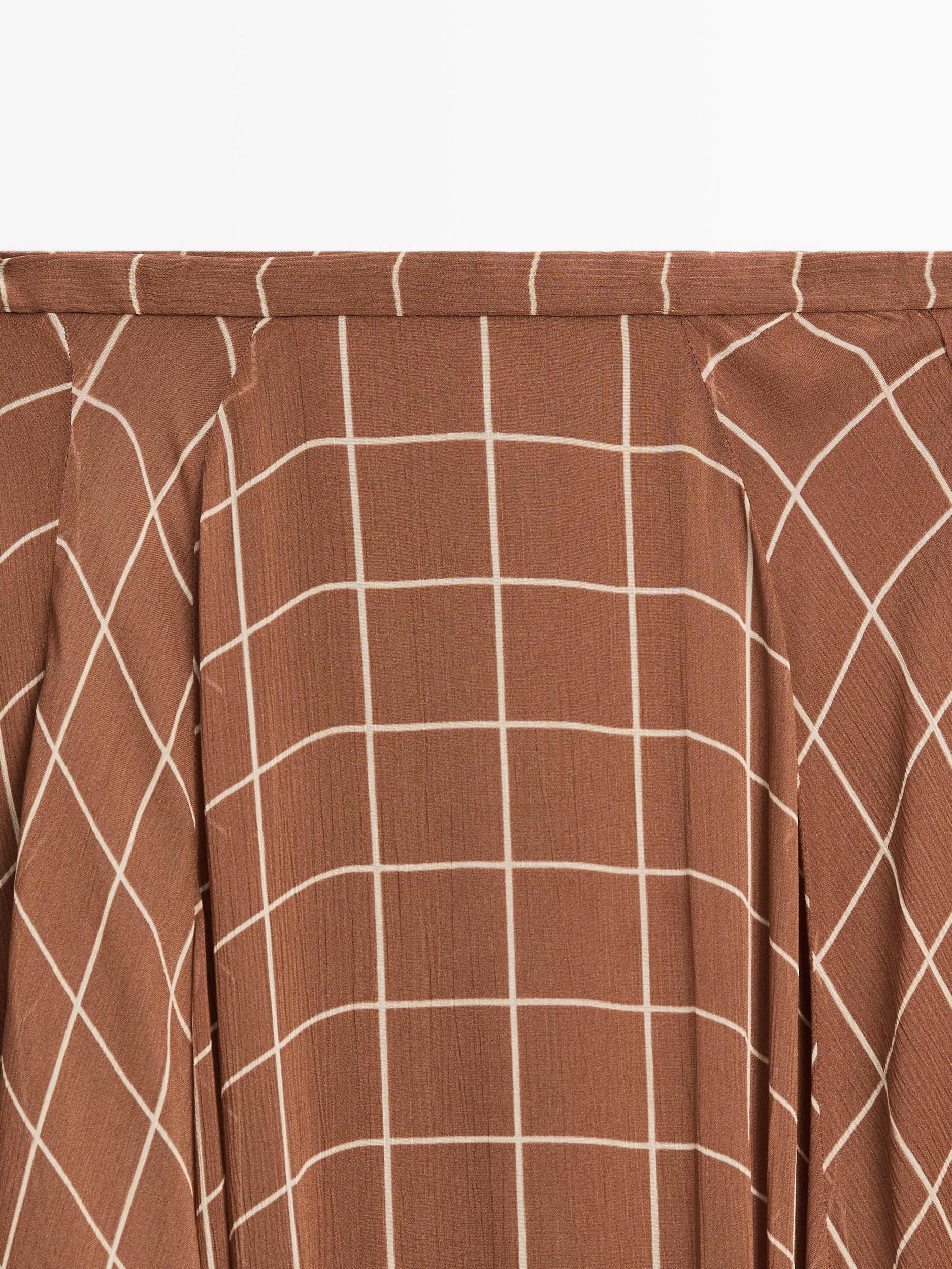 Long flowing skirt with checked detail Product Image