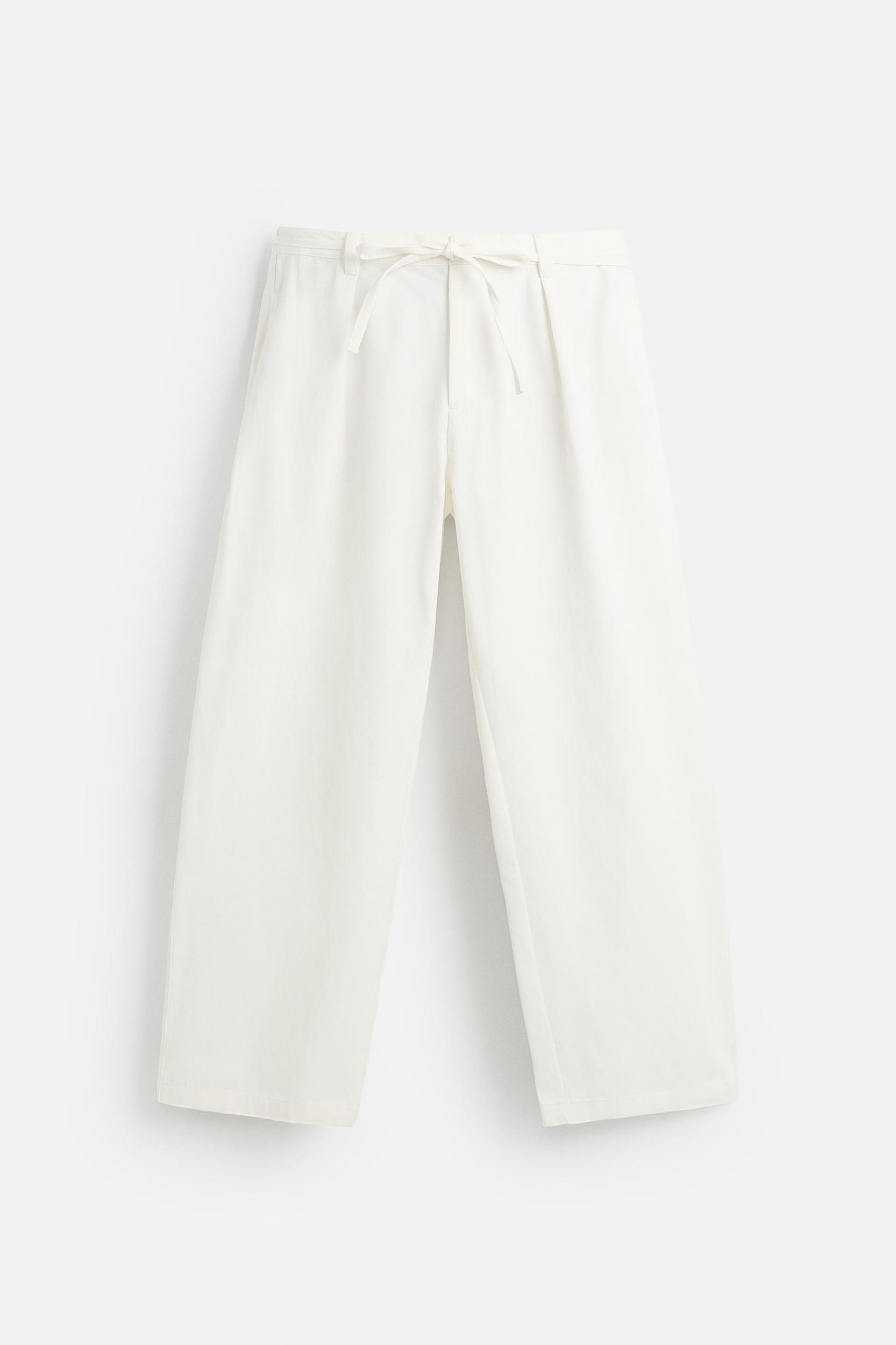 RELAXED FIT PLEATED PANTS Product Image