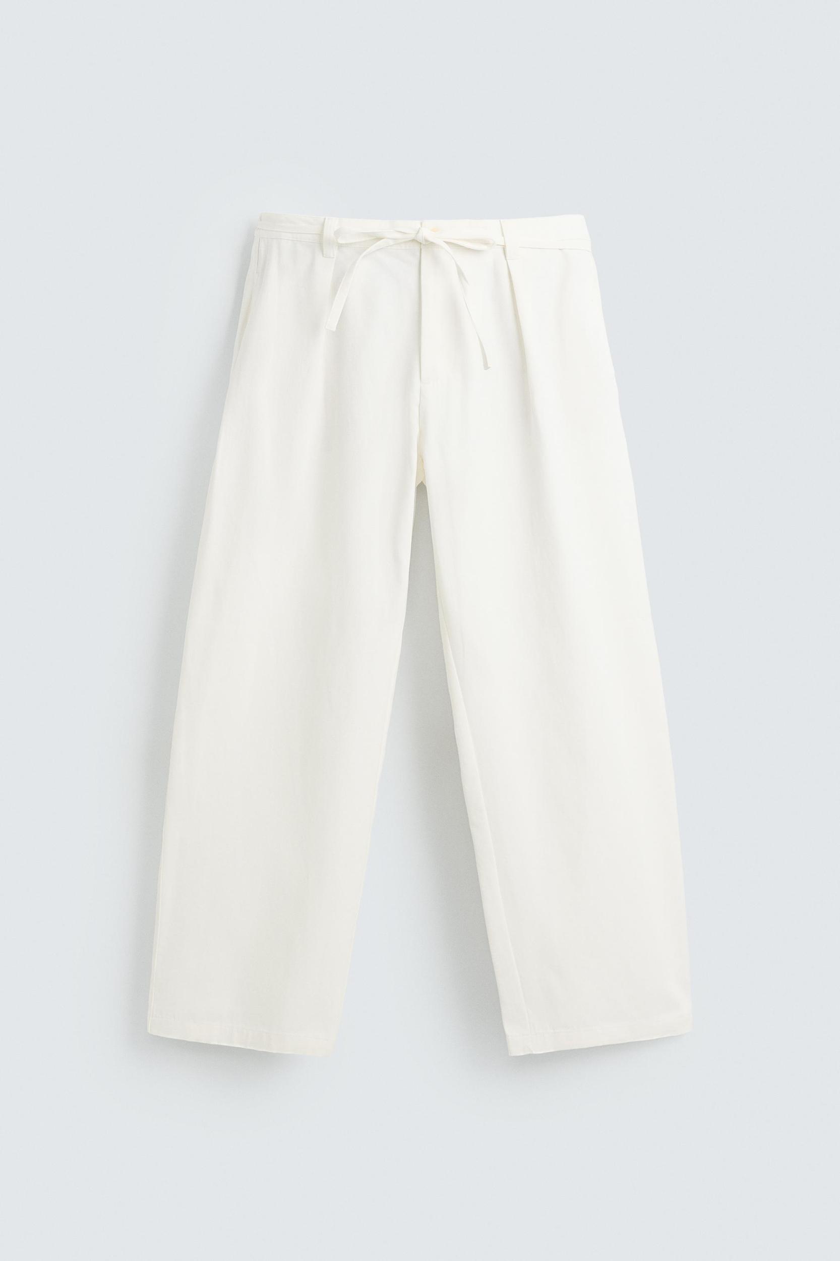 RELAXED FIT PLEATED PANTS Product Image