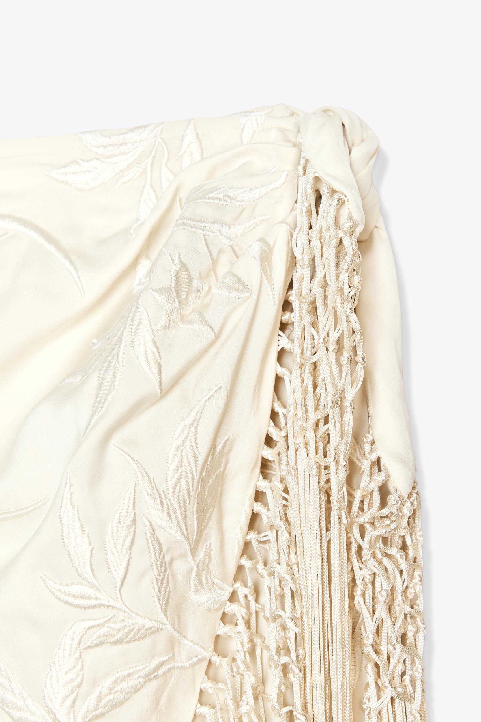 EMBROIDERED FRINGED WRAP SKIRT Product Image