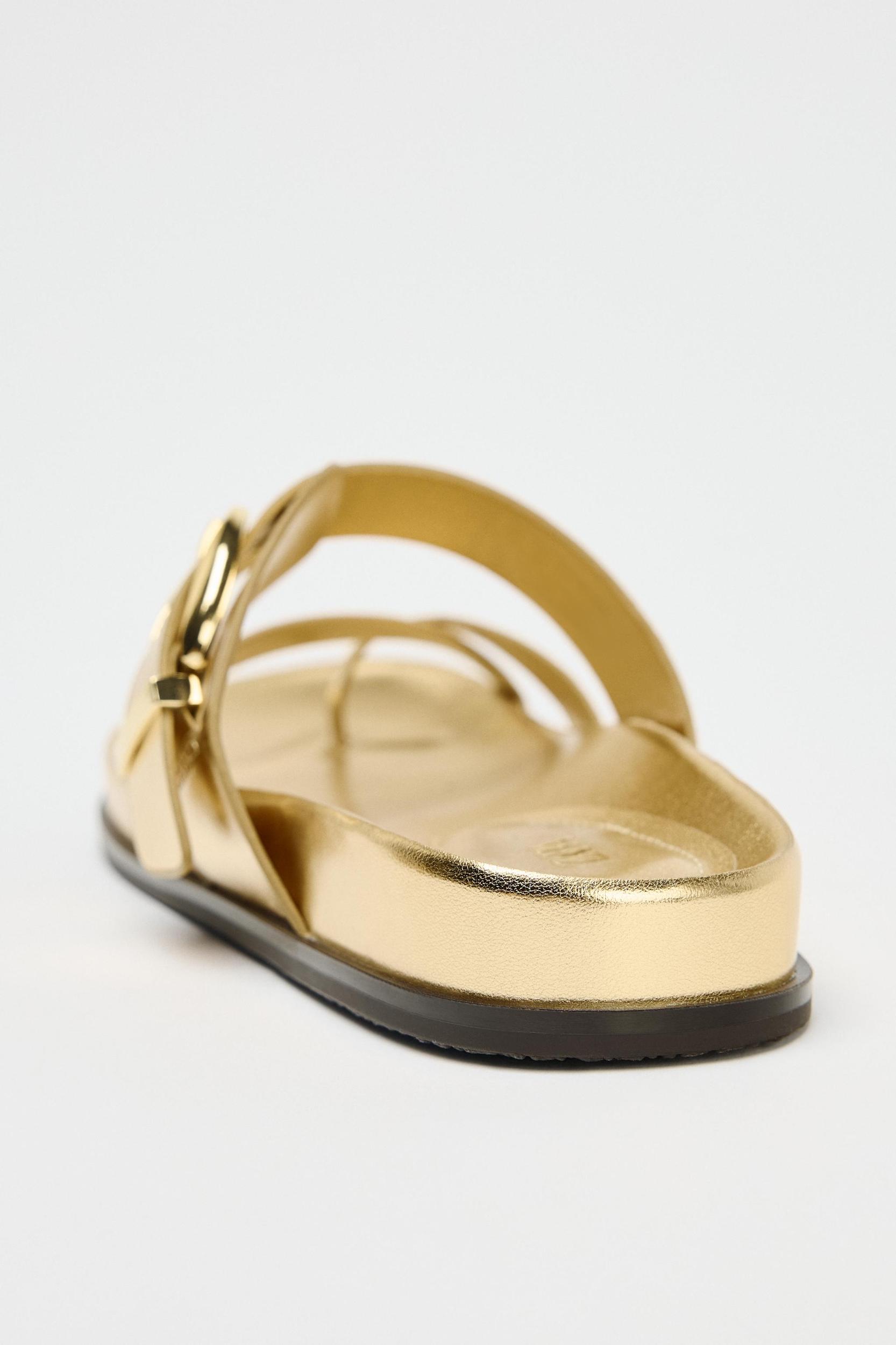 METALLIC EFFECT CROSSED STRAP SANDALS Product Image