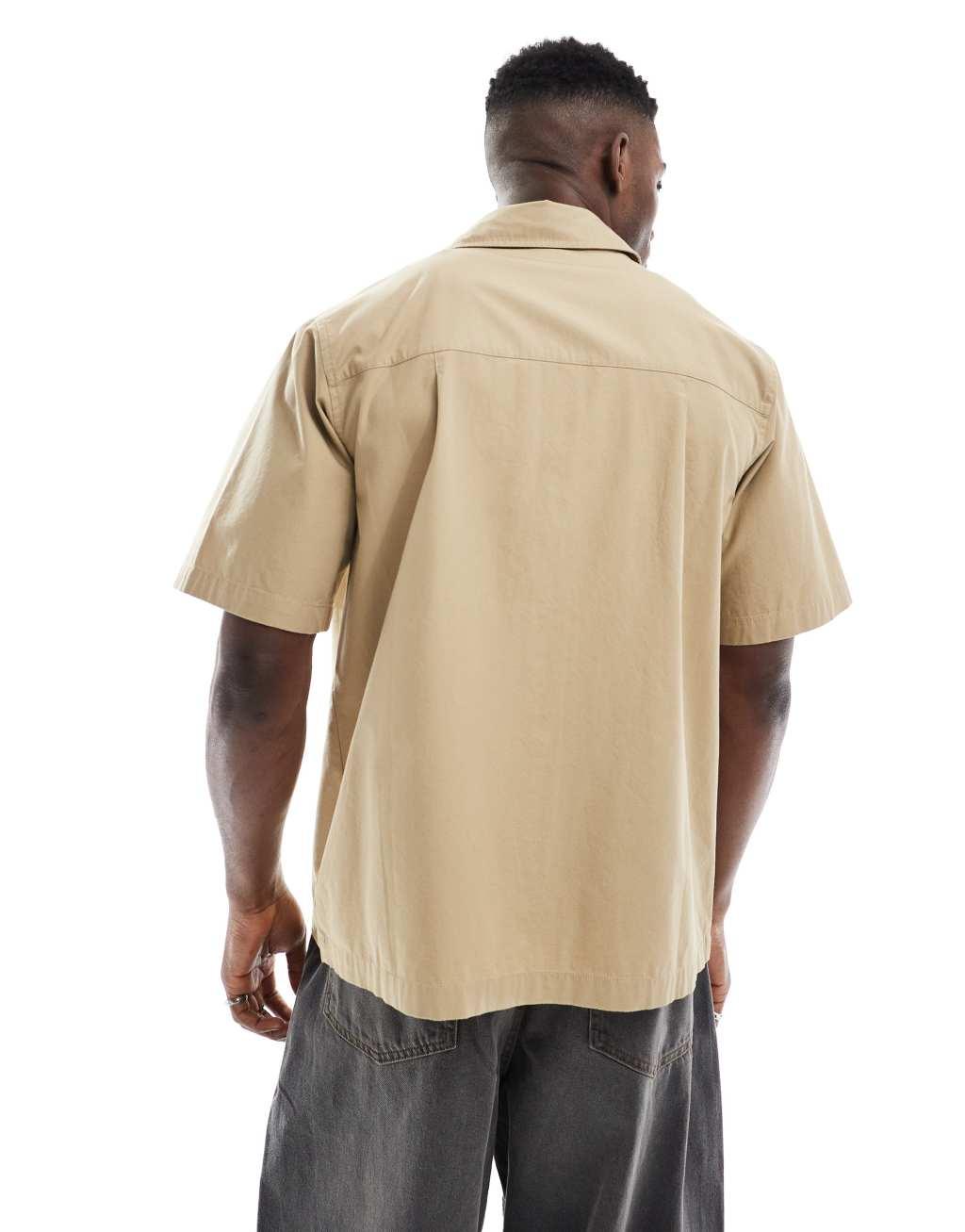 Nike Club short sleeve woven shirt in beige Product Image