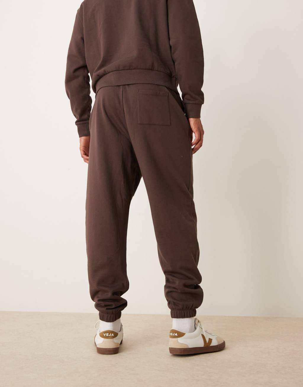 ASOS DESIGN essential oversized sweatpants in brown Product Image