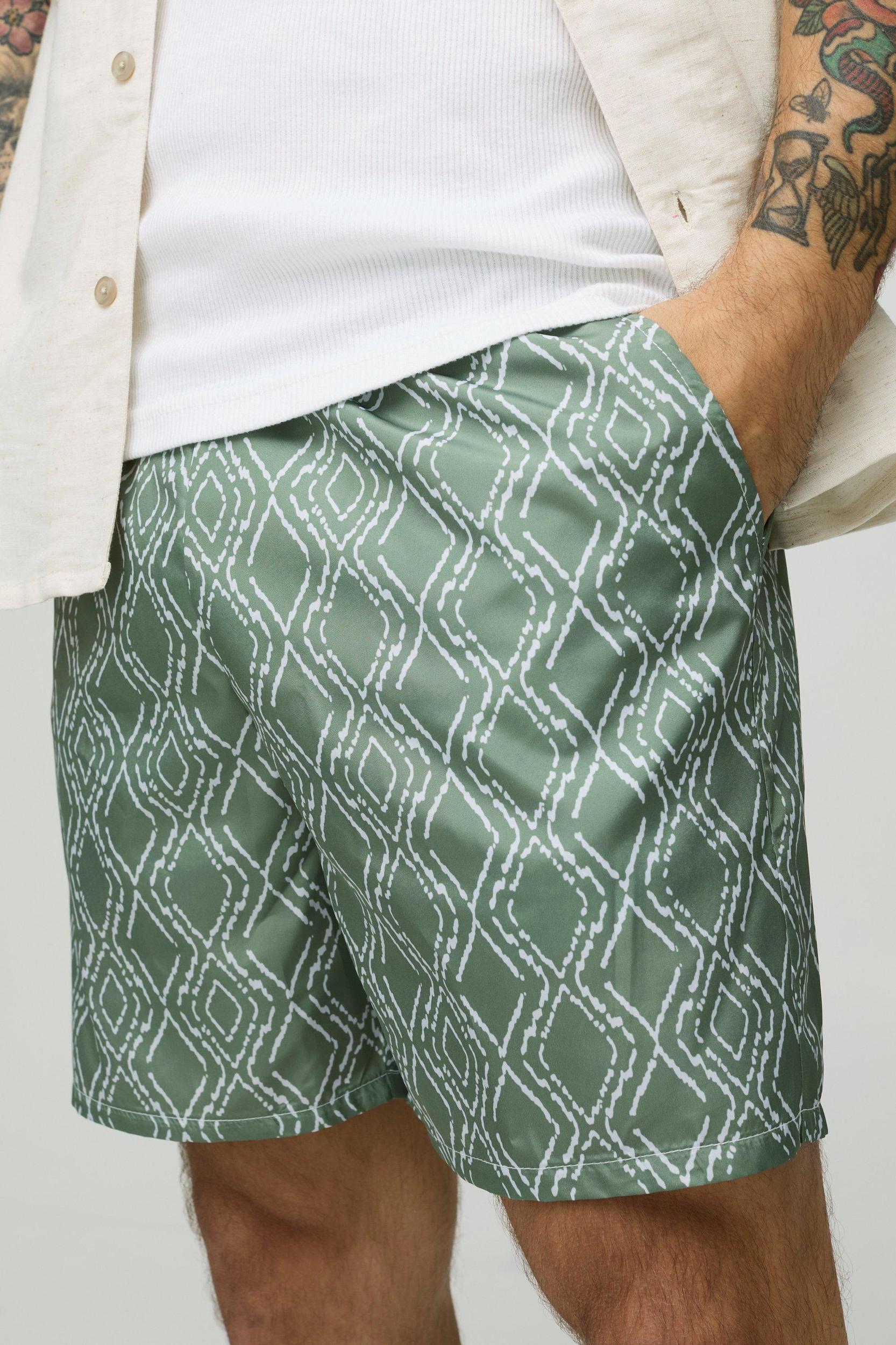 Abstract Pattern Mid Length Swim Trunks | boohooMAN USA Product Image