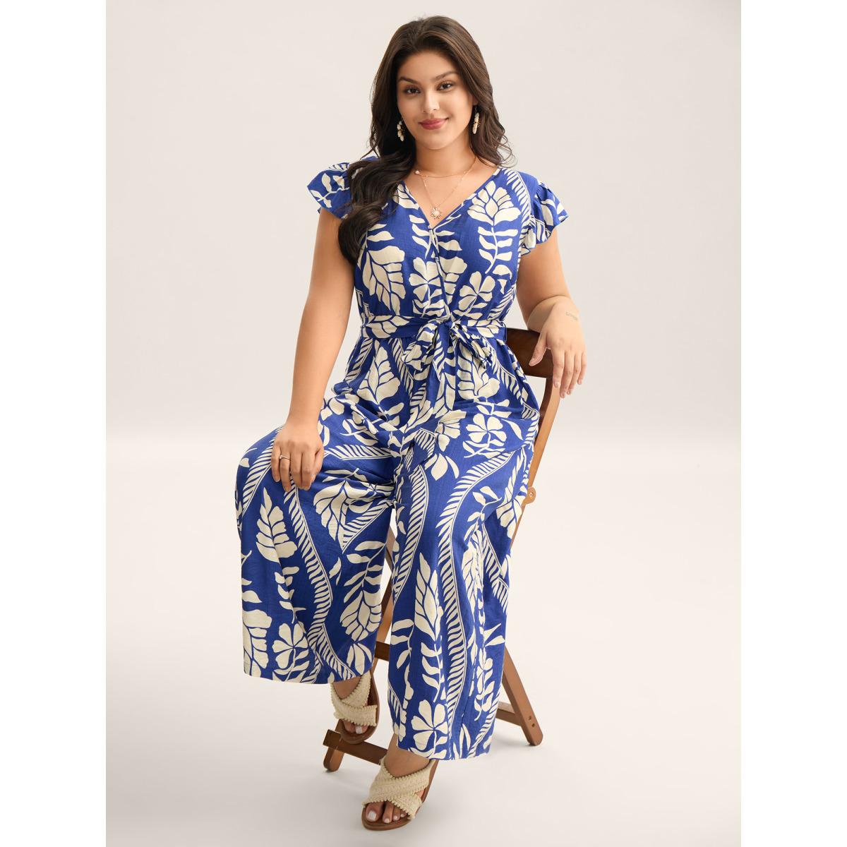 Plus Size Navy Large Floral Print Pockets Jumpsuit Women Resort Cap Sleeve Overlap Collar Vacation Loose Jumpsuits BloomChic 22-24/3X Product Image
